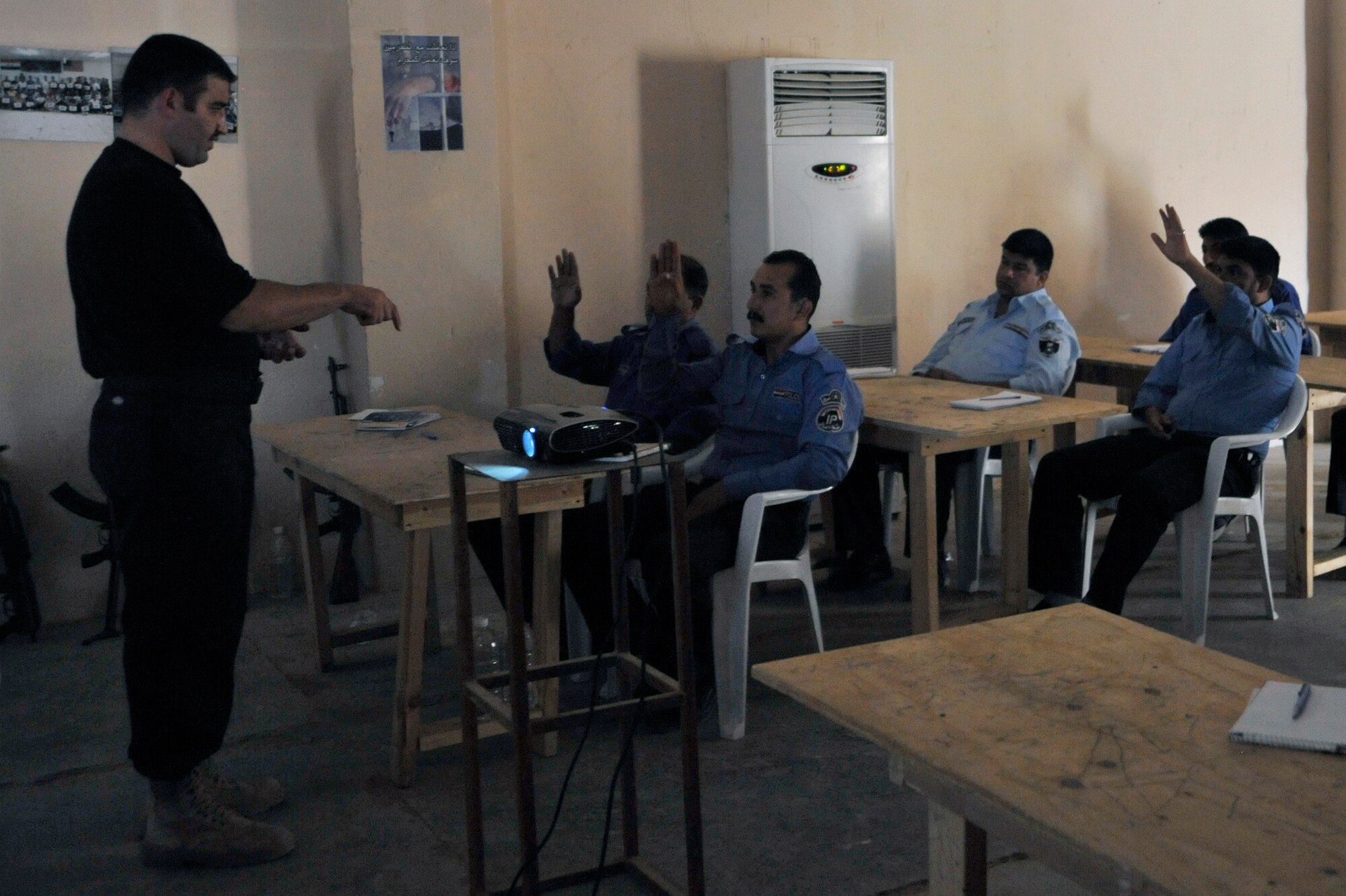 Lt. Ahed, Iraq Ministry of Interior instructor, teaches to Iraqi police students about the importance of gathering evidence in a crime scene, June 2, 2010, at Camp Taji, Iraq. This was the student's final day of class before graduating. The 732nd Expeditionary Security Forces Squadron, Detachment 3, completed their mission of facilitating the academy for the past ten months. (U.S. Air Force photo by Senior Airman Perry Aston) (Released)