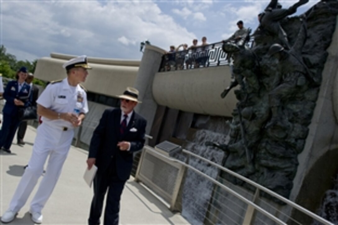 U.S. Navy Adm. Mike Mullen, chairman of the Joint Chiefs of Staff, tours the National D-Day Memorial with Retired U.S. Army Col. William A. McIntosh, president, National D-Day Memorial Foundation, in Bedford, Va., June 6, 2010. Mullen delivered the keynote address at the celebration marking the 66th anniversary of the allied invasion of France during World War II.