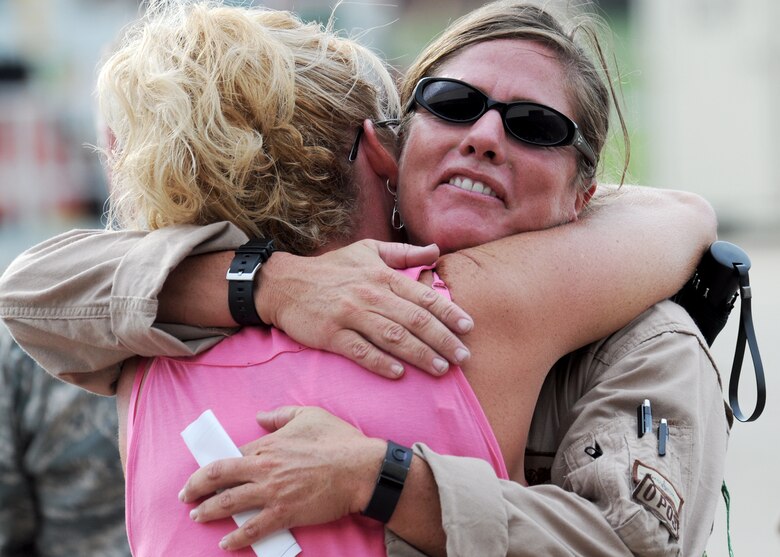 Tech. Sgt. Jamie Proehl, 711th Special Operations Wing, receives a welcome home hug after returning from an Operation Iraqi Freedom deployment June 6 at Eglin Air Force Base, Fla.  More than 70 Airmen from Duke Field returned home from their deployment June 5 and 6.  Friends, family, co-workers and community leaders came out to greet them and welcome the Airmen home.  (U.S. Air Force photo/Tech. Sgt. Samuel King Jr.)