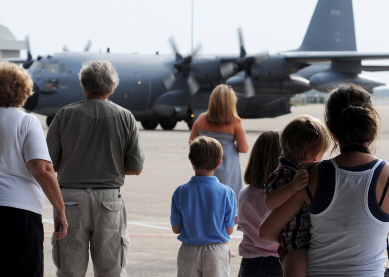 Family members wait for their loved ones to exit the 919th Special Operations Wing Combat Talon June 6 at Eglin Air Force Base, Fla. More than 70 Airmen from Duke Field returned home from an Operation Iraqi Freedom deployment June 5 and 6. Friends, family, co-workers and community leaders came out to greet them and welcome the Airmen home. (U.S. Air Force photo/Tech. Sgt. Samuel King Jr.)