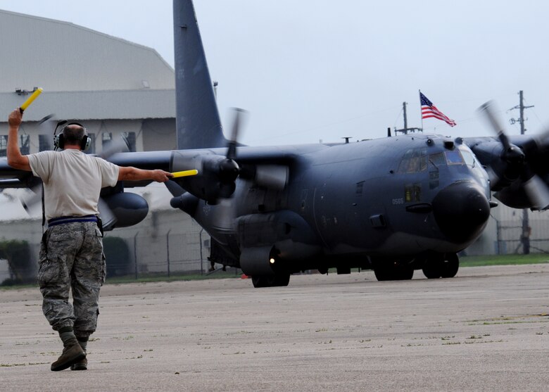 A 919th Maintenance Group crew chief marshals in a Combat Talon returning home from an Operation Iraqi Freedom deployment to Eglin Air Force Base, Fla., June 6. More than 70 reservists and two Combat Talons from Duke Field returned home June 5 and 6. Friends, family, co-workers and community leaders came out to greet them and welcome the Airmen home. (U.S. Air Force photo/Tech. Sgt. Samuel King Jr.)