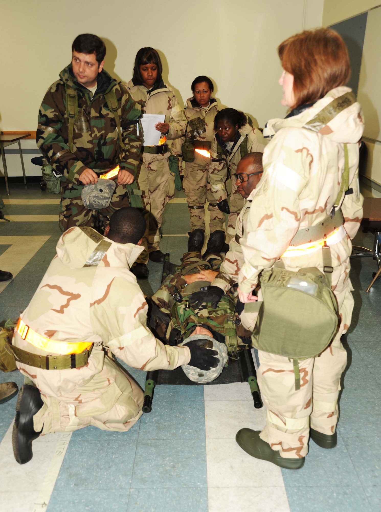 Lt. Col. Florin Georgescu, team leader for the 622nd ASTS, directs team members to start the assessment to the injured Airman. Critical assessments and application of life-saving procedures saved the Airman's life, and after a short stay at the medical center the Airman returned to his duty station. Simulations like this are part of the training scenarios that will prepare the 622nd and other units here at Volk Field for an upcoming Operational Readiness Inspection. (Air Force photo by Jerry Green)