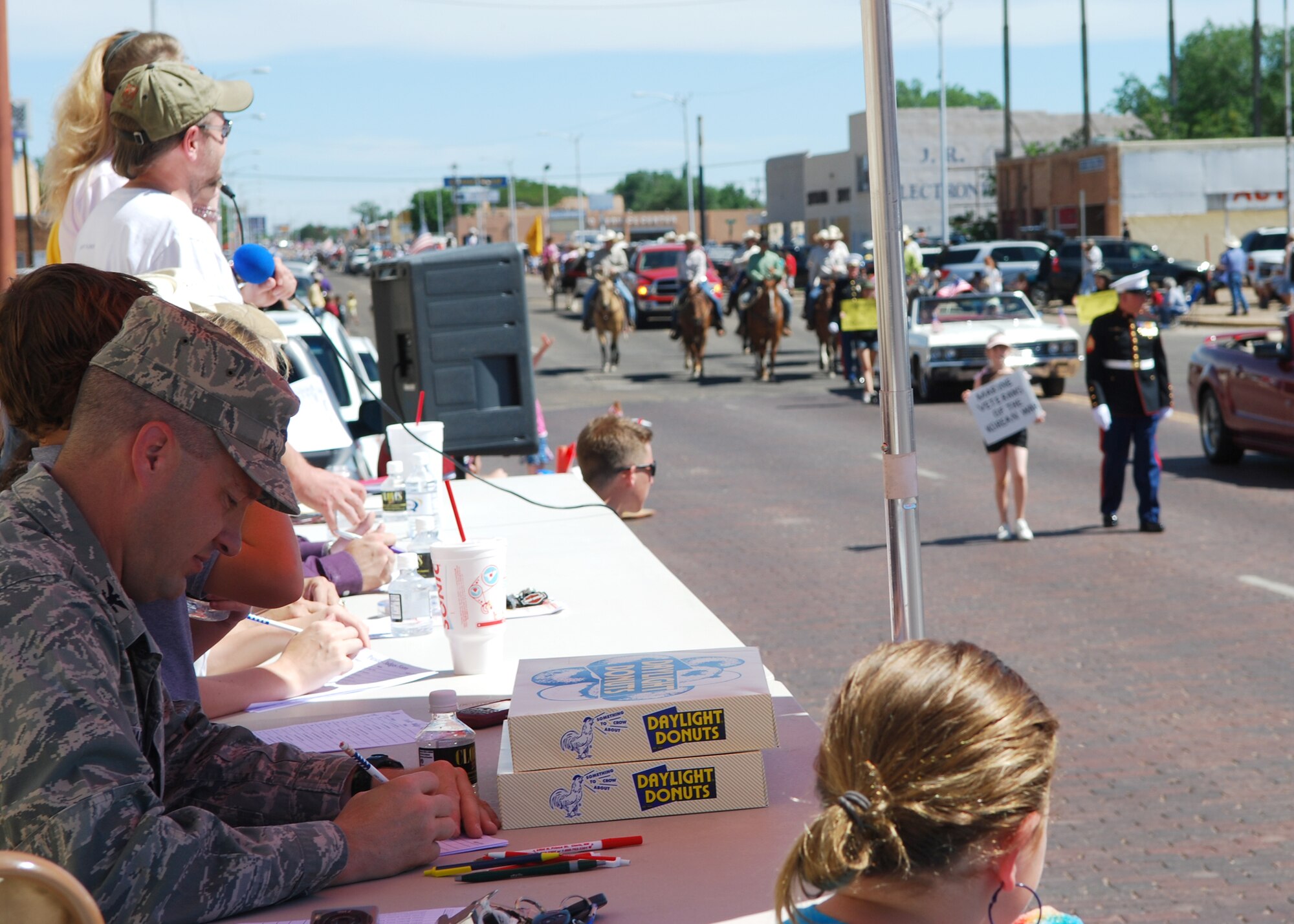 Col. James Cardoso, 27th Special Operations Wing vice commander, judges a passing parade participant during the 40th Annual Pioneer Days Parade on June 5. Among the Cannon participants in the parade celebrating the people who founded Clovis included the base's Honor Guard and motorcycle-riding group. (U.S. Air Force photo by Maj. Mae-Li Allison) 

