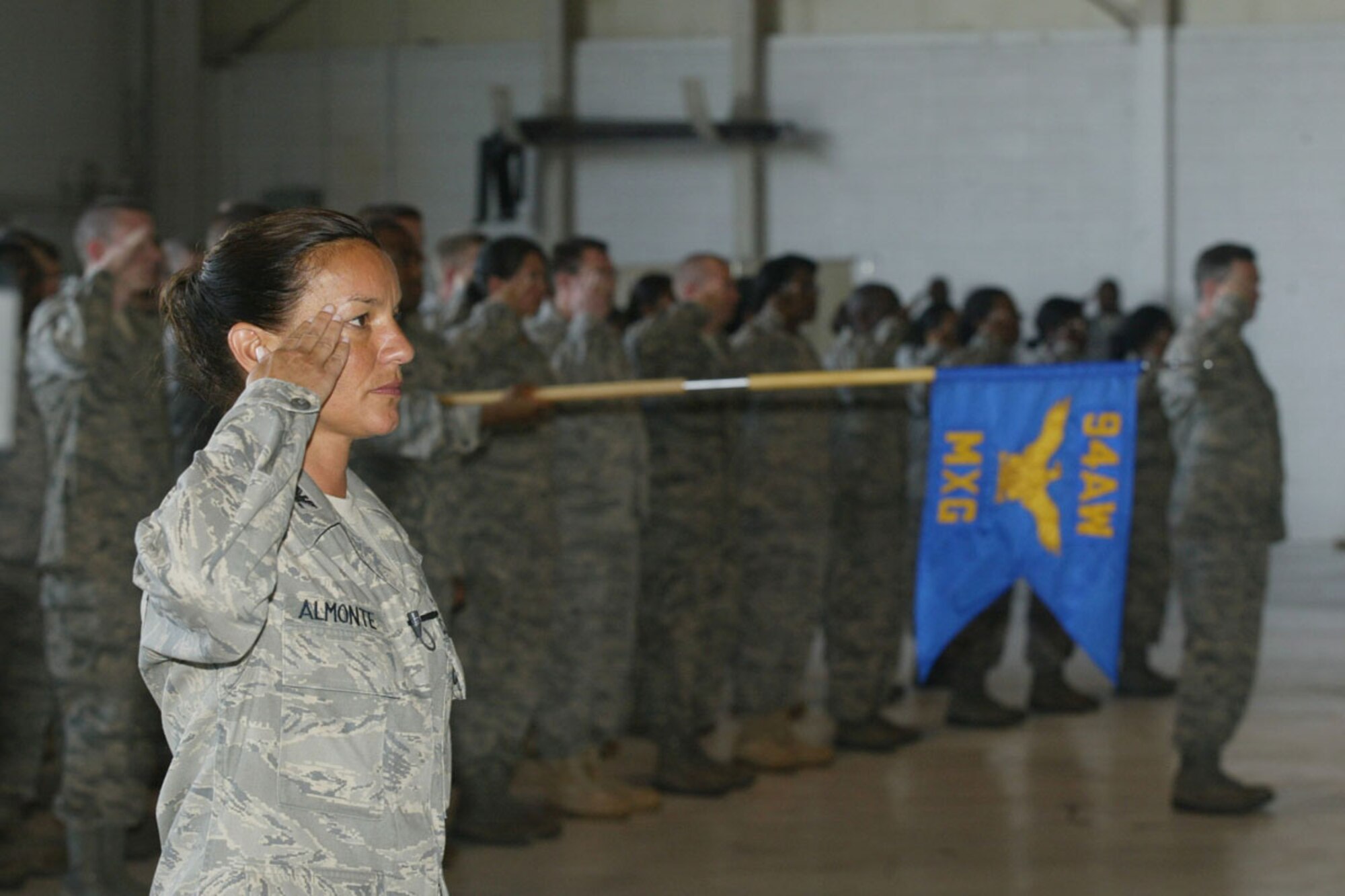 Col. Lourdes J. Almonte,inspector general,  94th Airlift Wing, leads wing personnel in officially welcoming Col. Timothy E. Tarchick as the new 94th AW Commander at a Change of Command ceremony here June 5. (U.S. Air Force Photo/Don Peek)