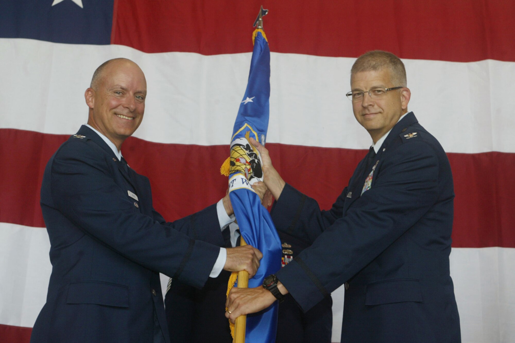 Col. Timothy E. Tarchick accepts the 94th Airlift Wing organizational flag from Col. Jon G. Andre, Vice Commander of 22nd Air Force as he officially takes command of the 94th Airlift Wing in a ceremony here June 5. (U.S. Air Force Photo/Don Peek)
