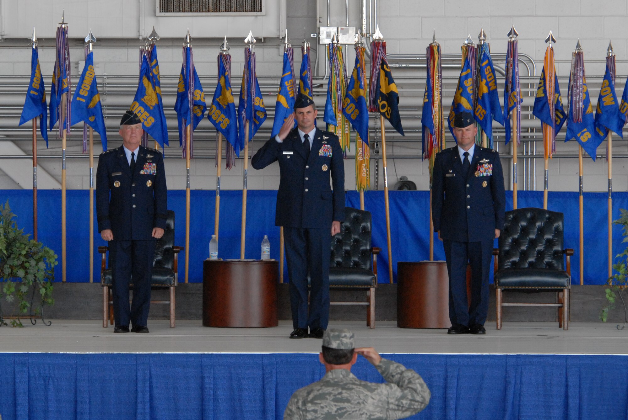 Colonel Michael Plehn, incoming 1st Special Operations Wing commander, salutes members of the 1st SOW during a change of command ceremony June 7. Col. Greg Lengyel relinquished his command to the master navigator after nearly two years at the helm of the wing. (DoD photo by Air Force Staff Sgt. Orly Tyrell)