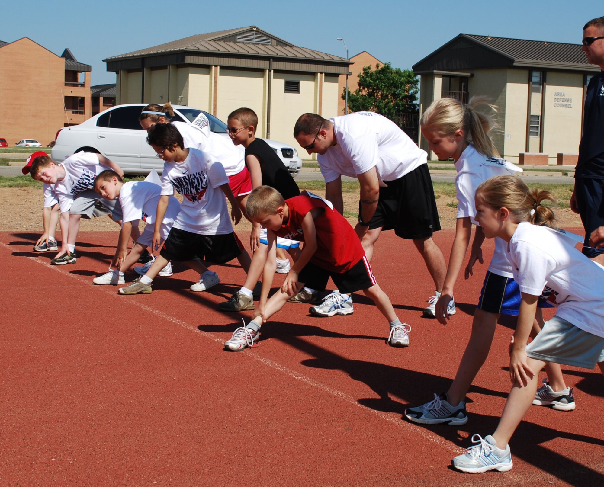 Seven-and 8-year-old children and their families prepare for a 1-mile run during the American Armed Forces Kids Run at the 1-mile track on Sheppard Air Force Base, Texas, June 5, 2010. More than 100 participants dashed around the track, running distances ranging from .5 to 2 miles. (U.S. Air Force photo/ Airman 1st Class Valerie Hosea)
