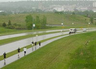MINOT, N.D. -- Members of Team Minot participate in the Minot Special Olympic Torch Run here June 3. In spite of foul weather, participants ran the full 16 miles, which started from the Magic City Gate of Minot AFB and ended in downtown Minot. (U.S. Air Force photo by Senior Airman Ashley N. Avecilla) 