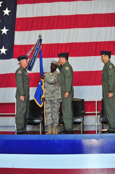 100605-F-8430J-148SHAW AIR FORCE BASE, S.C. -- Colonel Charles Moore salutes Major General William Holland during the change of command on June 4, 2010. Airmen of the 20th FW came together in Hangar 1200 here to welcome their new commander. Colonel Charles Moore took over command of the 20th FW from Col. Joseph Guastella at a ceremony officiated by Maj. Gen. William Holland, 9th Air Force commander. (U.S. Air Force photo/Airman 1st Class Amber E. Jacobs)