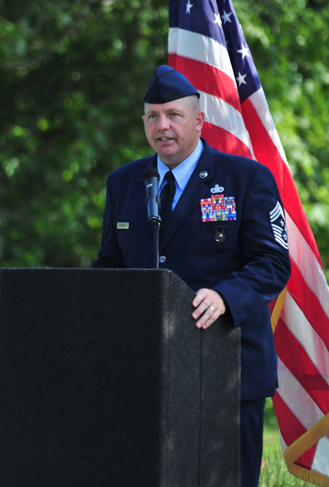 100602-F-8430J-163
SHAW AIR FORCE BASE, S.C. - Chief Master Sgt. Scott Dearduff, 9th Air Force command chief, addresses the crowd at the dedication ceremony for the Fallen Airmen Memorial at Memorial Lake June 2, 2010. The Fallen Airmen Memorial is dedicated to all Airmen who have died in combat. The memorial will be a living monument, so it can be adjusted at any time as combat goes on and wars come and go. (U.S. Air Force photo/Airman 1st Class Amber E. N. Jacobs)