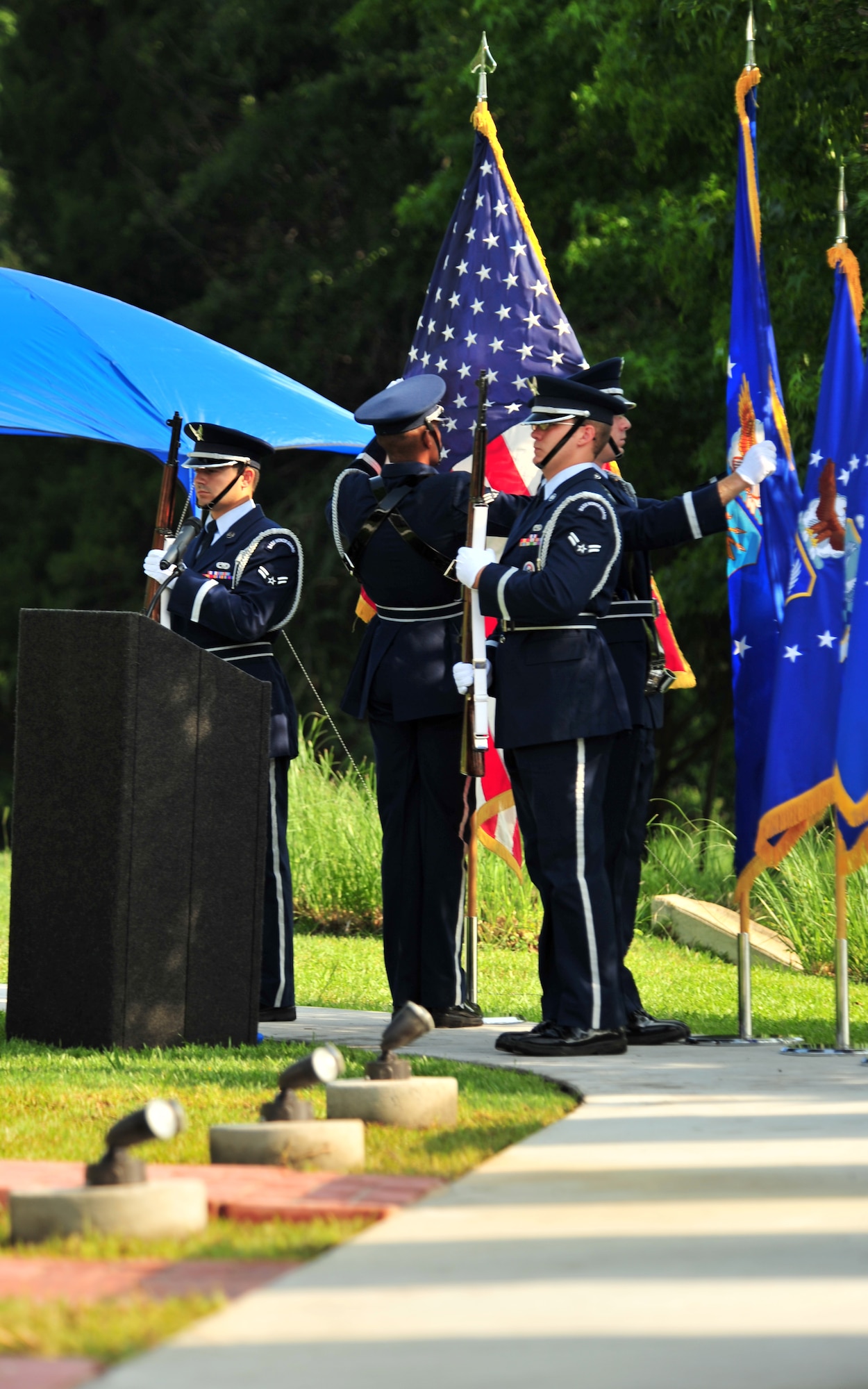 100602-F-8430J-107
SHAW AIR FORCE BASE, S.C. - Members of the Shaw Air Force Base Honor Guard adjust the flags at The Fallen Airmen Memorial dedication in preparation for the ceremony June 2, 2010. The Fallen Airmen Memorial is dedicated to all Airmen who have died in combat. The memorial will be a living monument, so it can be adjusted at any time as combat goes on and wars come and go. (U.S. Air Force photo/Airman 1st Class Amber E. N. Jacobs)