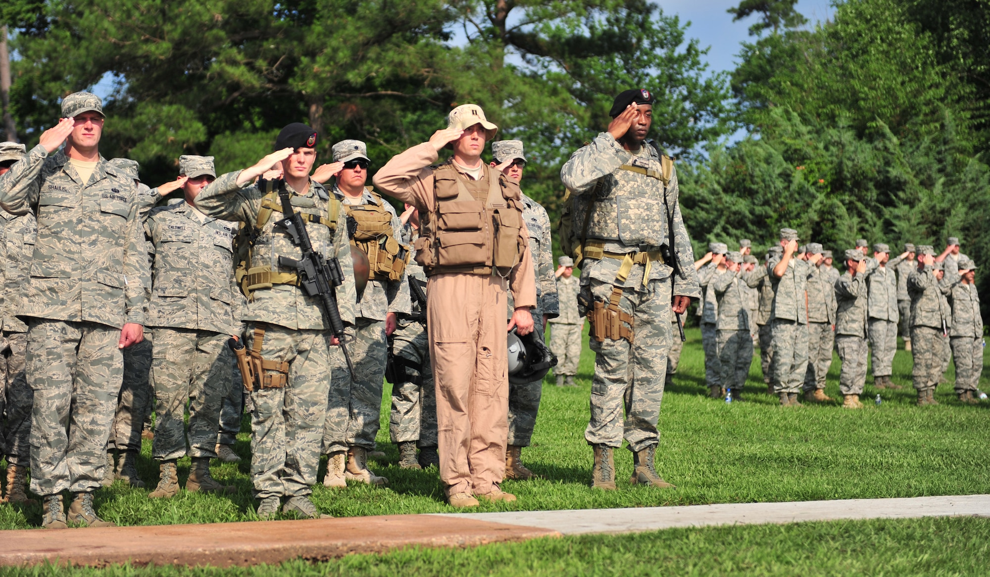 100602-F-8430J-099
SHAW AIR FORCE BASE, S.C. -Members of the 20th Fighter Wing pay their respects as the National Anthem is played before dedication ceremony of the Fallen Airmen Memorial at Memorial Lake June 2, 2010. Each person in the formation represents Airmen killed in combat and their career fields. The Fallen Airmen Memorial is dedicated to all Airmen who have died in combat. The memorial will be a living monument, so it can be adjusted at any time as combat goes on and wars come and go. (U.S. Air Force photo/Airman 1st Class Amber E. N. Jacobs)