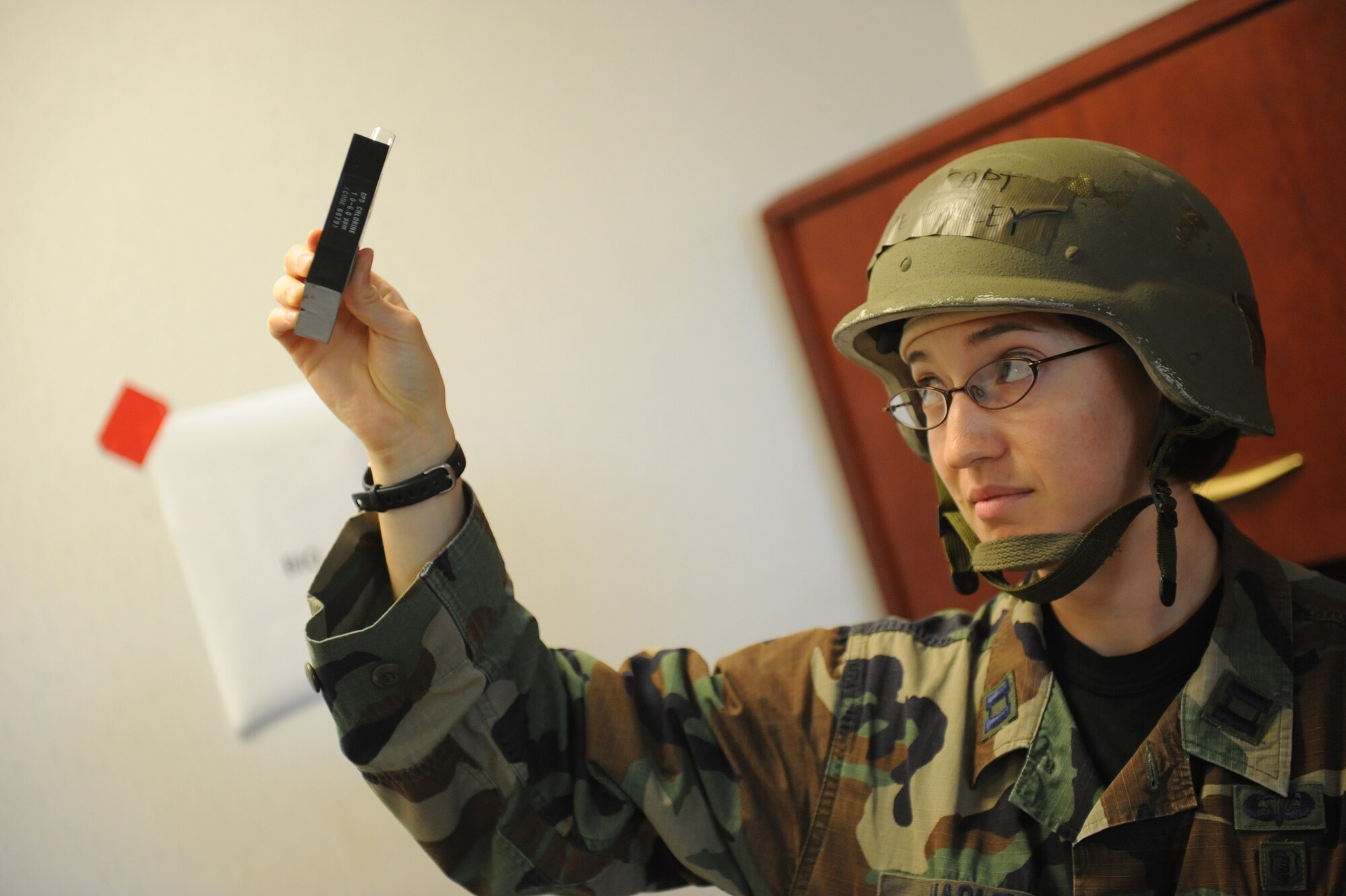 MOODY AIR FORCE BASE, Ga. -- Capt. Stephanie Harley, 23rd Medical Group bioenvironmental engineer, tests a sample of water for chemicals that could have contaminated it during a Phase II Operational Readiness Exercise here June 4. It is important to test water sources during war time for any chemical agents enemies may use. (U.S. Air Force photo by Staff Sgt. Gina Chiaverotti-Paige/RELEASED)