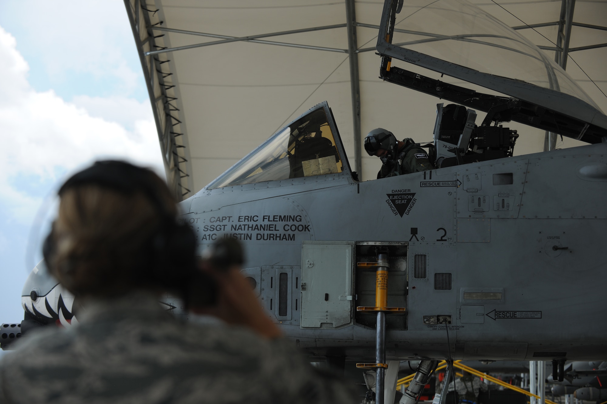 MOODY AIR FORCE BASE, Ga. -- Capt. Ryall Meyer, 75th Fighter Squadron A-10C Thunderbolt II pilot, begins to buckle in and prepare for takeoff during a Phase II Operational Readiness Exercise here June 3. One of the most important things is communication between the pilot and crew chief during every preflight inspection. (U.S.  Air Force photo by Airman 1st Class Joshua Green/RELEASED)
