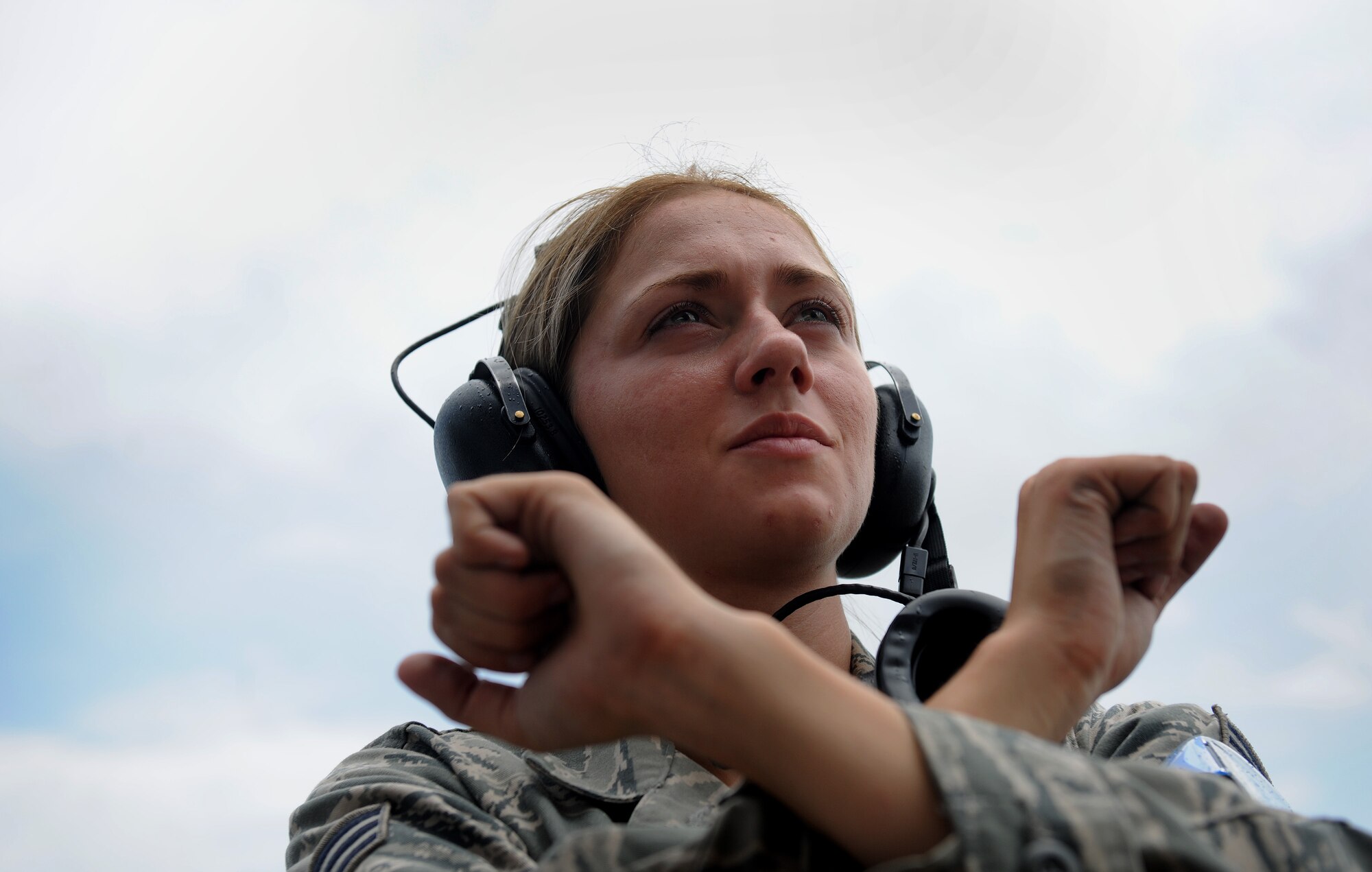 MOODY AIR FORCE BASE, Ga. -- Senior Airman Roxanne Kenney, 23rd Aircraft Maintenance Squadron crew chief, gives the hold signal to the pilot of an A-10C Thunderbolt II during a Phase II Operational Readiness Exercise here June 3. Communication between the pilot and crew chief is critical before takeoff to make sure everything on the aircraft is functioning properly. (U.S.  Air Force (U.S.  Air Force photo by Airman 1st Class Joshua Green/RELEASED))