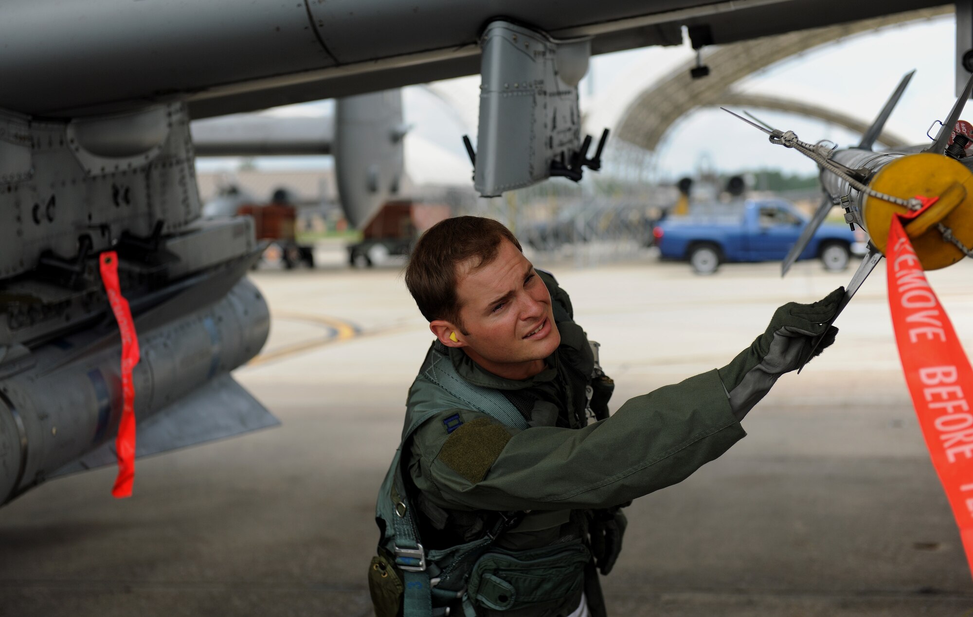 MOODY AIR FORCE BASE, Ga. -- Capt. Ryall Meyer, 75th Fighter Squadron A-10C Thunderbolt II pilot, inspects his aircraft before take off during a Phase II Operational Readiness Exercise here June 3. Before every takeoff, it’s mandatory for pilots and crew chiefs to inspect the aircraft, ensuring proper functioning capabilities. (U.S.  Air Force photo by Airman 1st Class Joshua Green/RELEASED)