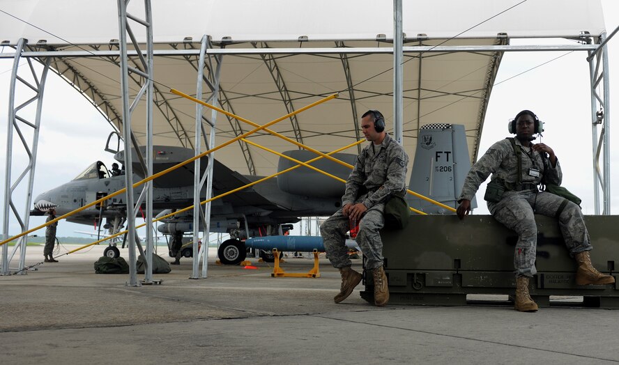 MOODY AIR FORCE BASE, Ga. -- Staff Sgt. Jeremy Sutter, 23rd Aircraft Maintenance Squadron crew chief, and Staff Sgt. Keyona McBride, 75th Aircraft Maintenance Unit aerospace propulsion journeyman, take a break for hydration and rest during a Phase II Operational Readiness Exercise here June 3. During the exercise, it is highly stressed to not only stay hydrated, but to take necessary breaks to avoid possible real-life injuries. (U.S.  Air Force photo by Airman 1st Class Joshua Green/RELEASED)