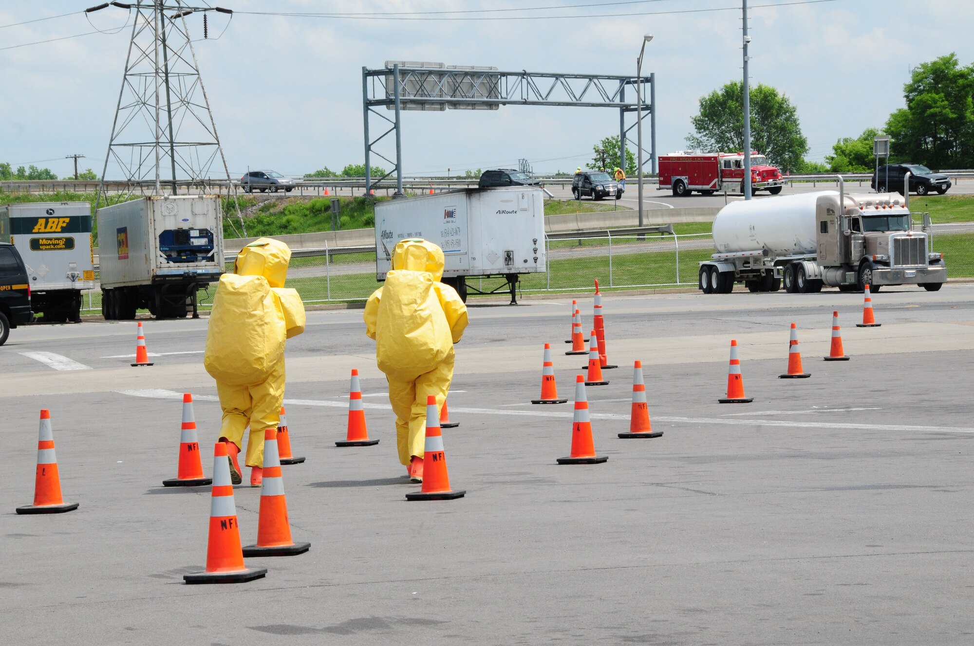 Two Niagara Falls Air Reserve Station Hazardous Material Technicians walk towards a tanker-truck suspected of leaking hazardous waste at the Queenston-Lewiston Bridge, Niagara Falls, NY June 4. After an inspection, it was found that there was no dangerous or hazardous material leaking from the vehicle.