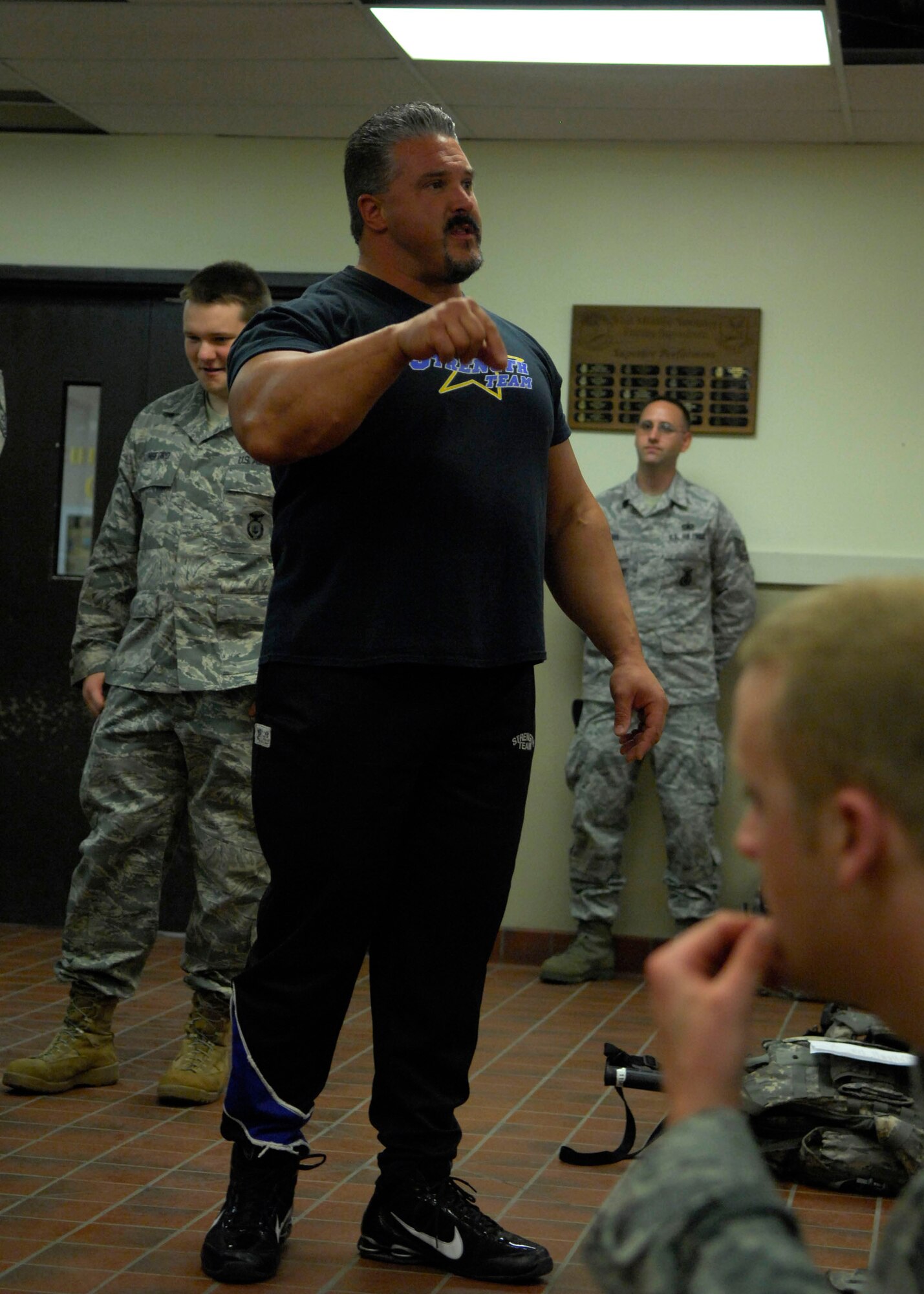 MINOT AIR FORCE BASE, N.D. -- Greg Mead, Strength Team member and former Air Force firefighter, talks to members of the 91st Security Forces Squadron here June 2. Meade discussed the importance of team work with those in attendance. (U.S. Air Force photo by Senior Airman Ashley N. Avecilla)
