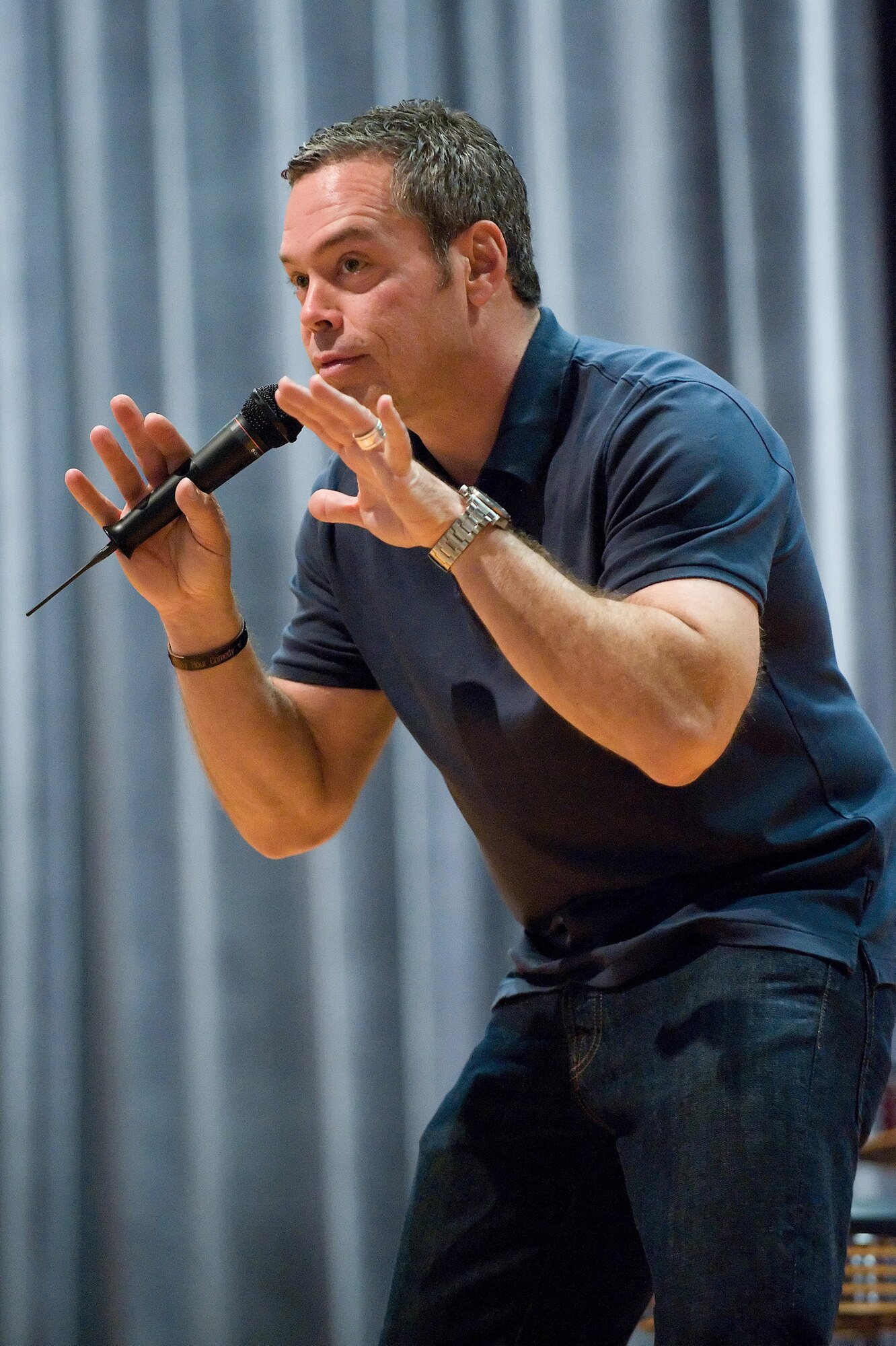 Team Dover members received a dose of 'Comedy is the Cure,' a new way of educating and entertaining in the one-hour presentation by comedian Bernie McGrenanhan June 3 and 4 at the Dover Air Force Base Theater. Mr. McGrenanhan uses jokes and humor, as well as a 30-minute serious talk on the subjects of alcohol, drug and sexual assault prevention, and risk-reduction safety. (U.S. Air Force photo/Jason Minto)