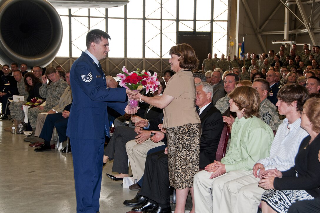 Mrs. Kelly, Colonel Richard W. Kelly's wife, accepts flowers in welcome from the airmen of the 141st Air Refueling Wing, Washington Air National Guard located at Fairchild Air Force Base, Washington. June 6, 2010. (U.S. Air Force photo by Master Sgt. Mindy Gagne/Released) 