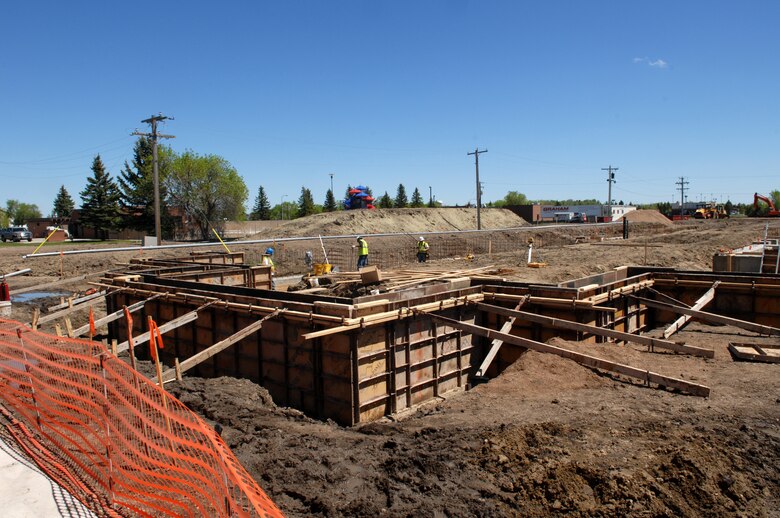 MINOT AIR FORCE BASE, N.D. -- Construction workers set the foundation for a new dormitory here May 26. The new dorms will consist of 168 rooms and will heighten Airmen morale, allowing them to better accomplish the base’s mission. (U.S. Air Force photo by Airman 1st Class Aaron-Forrest Wainwright)