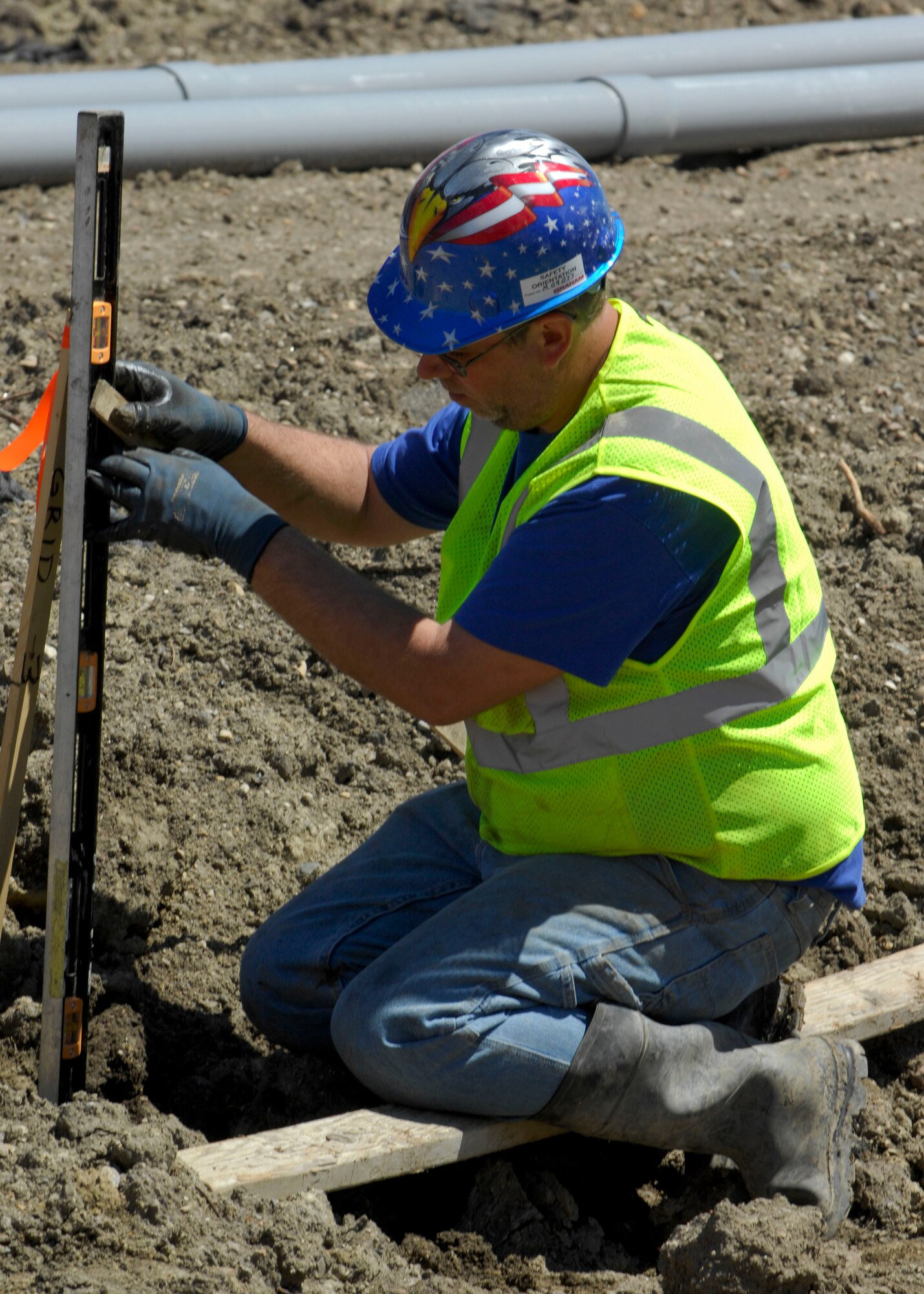MINOT AIR FORCE BASE, N.D. -- Kramer Mathison, construction worker, helps set the foundation for the new dormitory here May 26. The new dorms will consist of 168 rooms and will heighten Airmen morale, allowing them to better accomplish the base’s mission. (U.S. Air Force photo by Senior Airman Ashley N. Avecilla) 