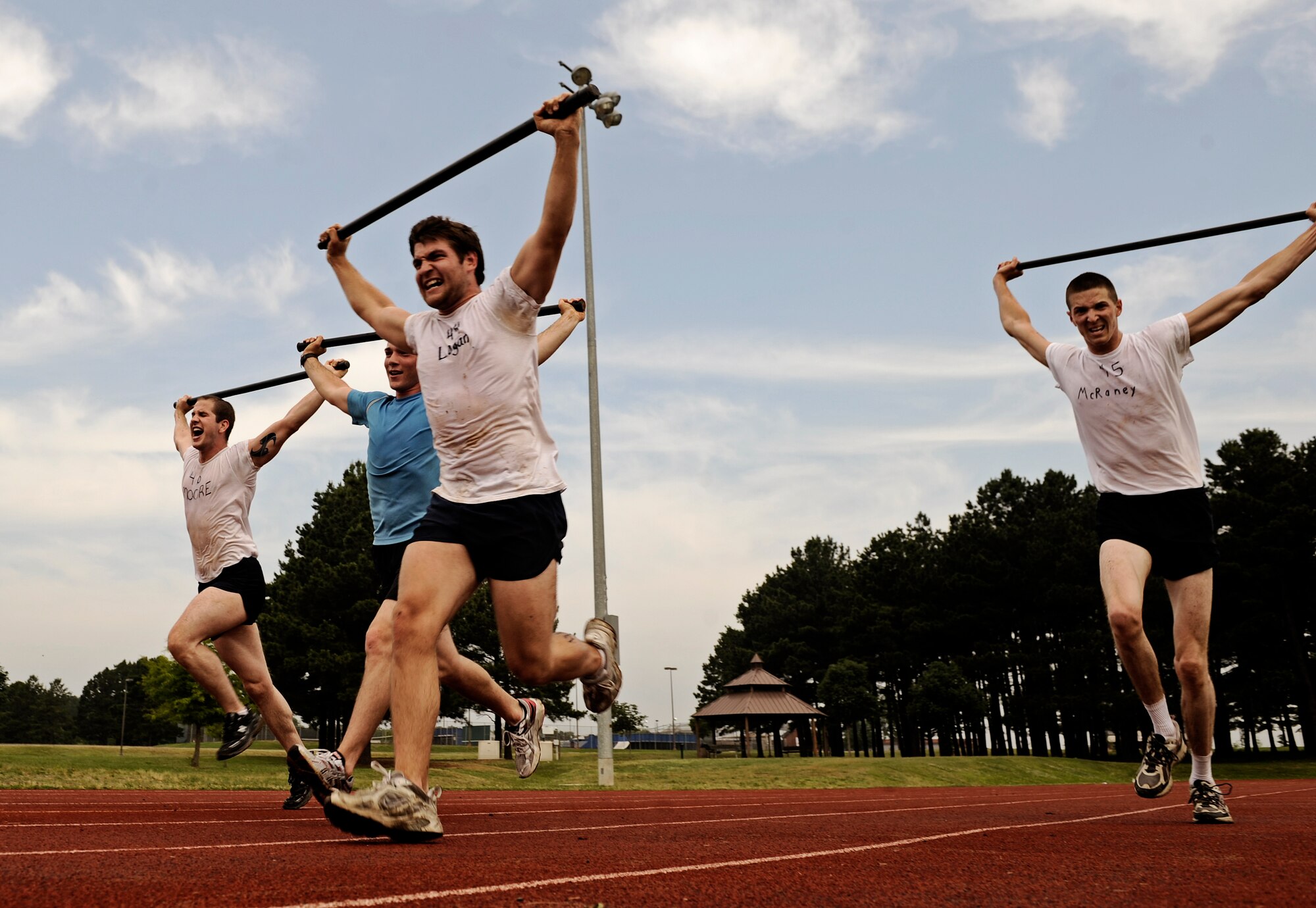 Battlefield Airman trainees sprint across the finish line, completing a competition of strength and stamina June 4, 2010 at Little Rock Air Force Base, AR. Future Airmen, currently in the delayed entry program, were given the opportunity to train with Air Force combat controllers, pararescuemen and various other special operations career fields. The training is designed to better prepare them for the indoctrination course that they will go through for their specific career field. (U.S. Air Force photo/ Senior Airman Ryan Crane)