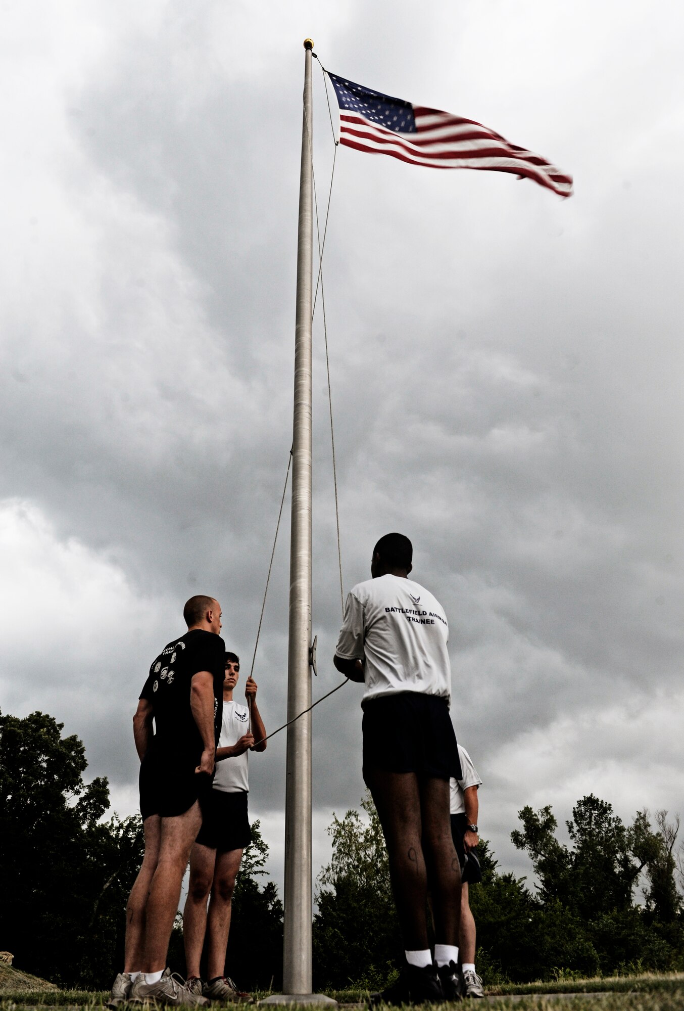 Battlefield Airman trainees lower the flag at during a retreat ceremony June 3, 2010 at Little Rock Air Force Base, AR. Future Airmen, currently in the delayed entry program, were given the opportunity to train with Air Force combat controllers, pararescuemen and various other special operations career fields. The training is designed to better prepare them for the indoctrination course that they will go through for their specific career field. (U.S. Air Force photo/ Senior Airman Ryan Crane)