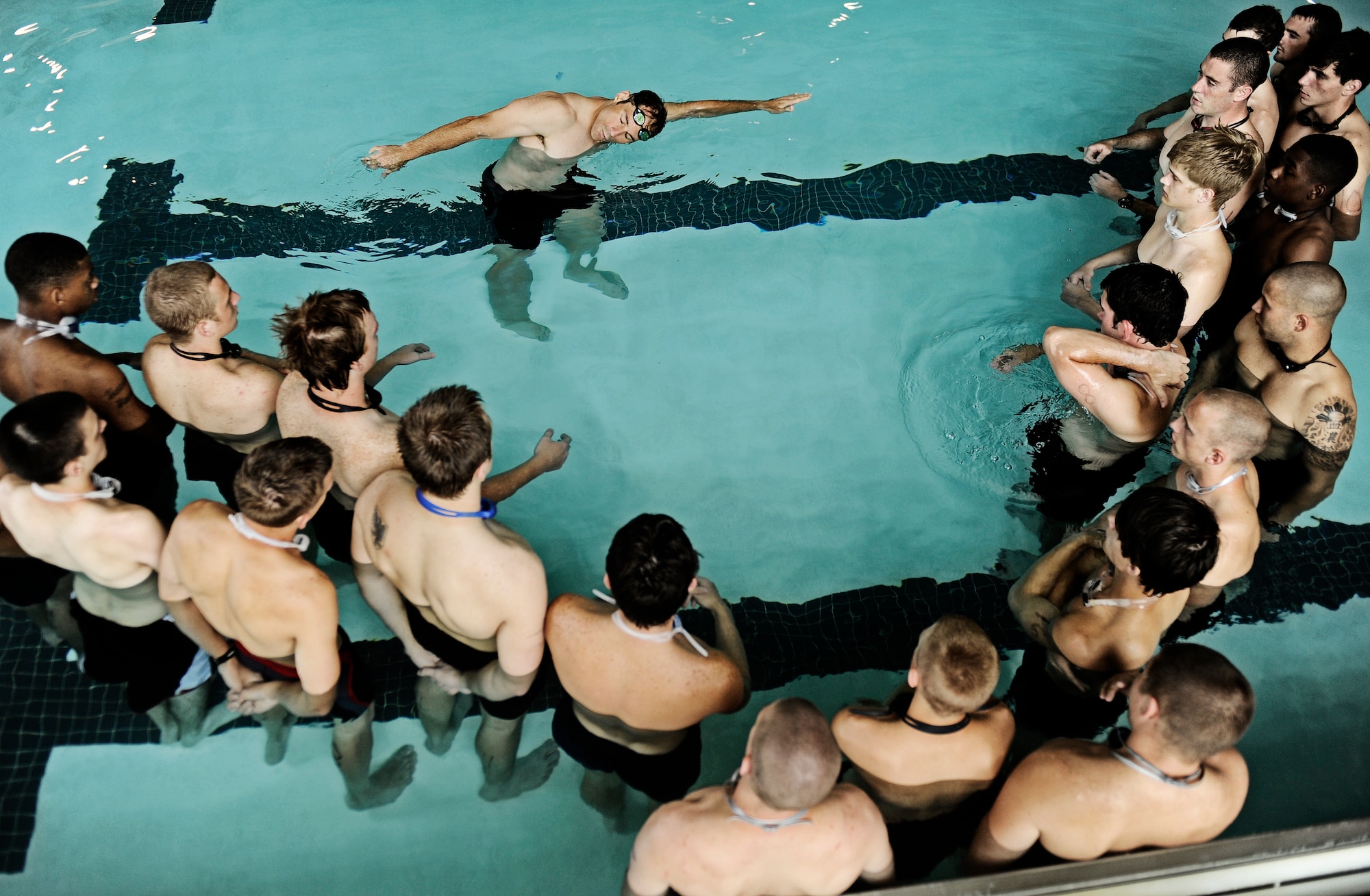 Tech Sgt. Nick Seible, combat control instructor, demonstrates to future battle field Airmen the proper way to perform the freestyle swim to pass the physical ability and stamina test June 3, 2010 at Little Rock Air Force Base, AR. Future Airmen, currently in the delayed entry program, were given the opportunity to train with Air Force combat controllers, pararescuemen and various other special operations career fields. The training is designed to better prepare them for the indoctrination course that they will go through for their specific career field. (U.S. Air Force photo/ Senior Airman Ryan Crane)