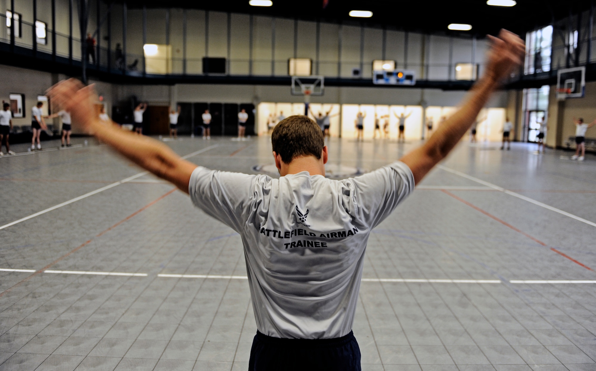 A Battlefield Airman trainee stretches out his shoulders prior to participating in a group cross-fit exercise June 3, 2010 at Little Rock Air Force Base, AR. Future Airmen, currently in the delayed entry program, were given the opportunity to train with Air Force combat controllers, pararescuemen and various other special operations career fields. The training is designed to better prepare them for the indoctrination course that they will go through for their specific career field. (U.S. Air Force photo/ Senior Airman Ryan Crane)