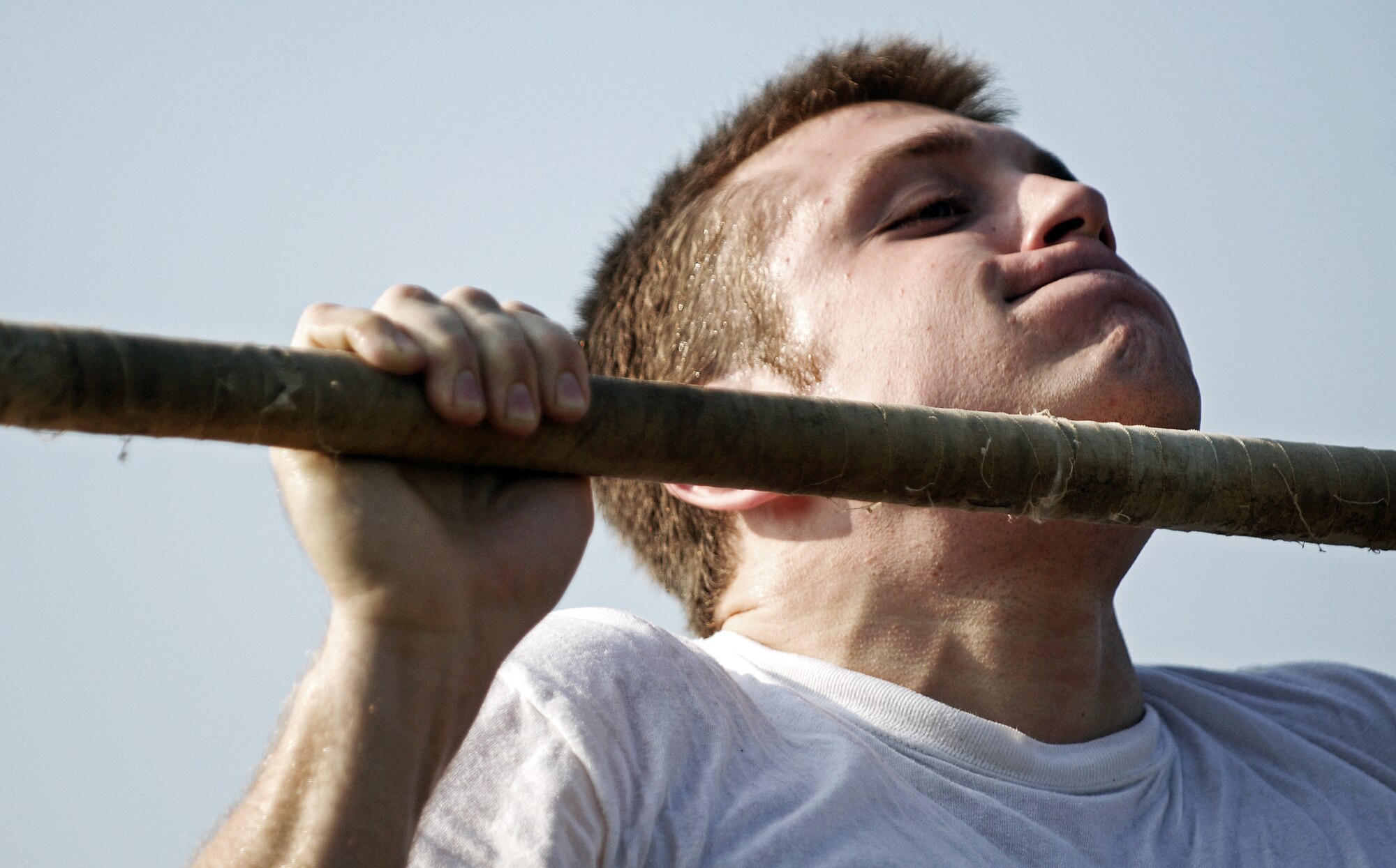A Battlefield Airman trainee pushes out one last pull up for his physical ability and stamina test June 2, 2010 at Little Rock Air Force Base, AR. Future Airmen, currently in the delayed entry program, were given the opportunity to train with Air Force combat controllers, pararescuemen and various other special operations career fields. The training is designed to better prepare them for the indoctrination course that they will go through for their specific career field. (U.S. Air Force photo/ Senior Airman Ryan Crane)