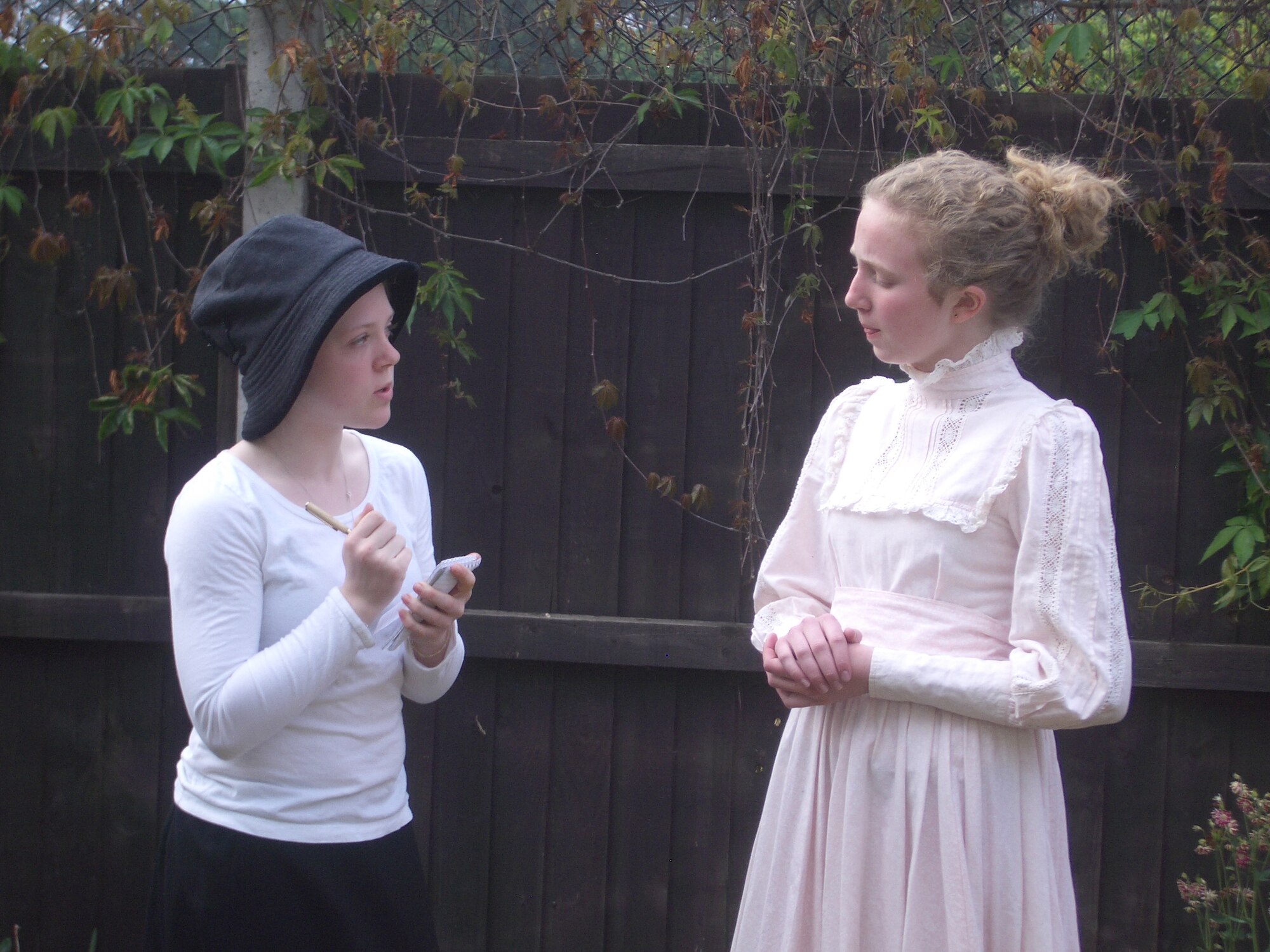 Abigail Moermond, 13-year-old daughter of Chaplain (Maj.) Timothy Moermond, 48th Fighter Wing Chapel, assumes the role of a reporter and interviews “women's suffrage leader Carrie Chapman Catt,” played by Jordyn Kent, 12-year-old daughter of Lt. Col. Debbie Kent, 48th Logistics Readiness Squadron commander, during a practice session May 22 at the base chapel.  The two Lakenheath Middle School students will perform a 10-minute skit about women’s suffrage and represent the Department of Defense Dependents School Europe at the National History Day contest at the University of Maryland June 13-17. (Courtesy photo by U.S. Air Force Chaplain (Maj.) Timothy Moermond)