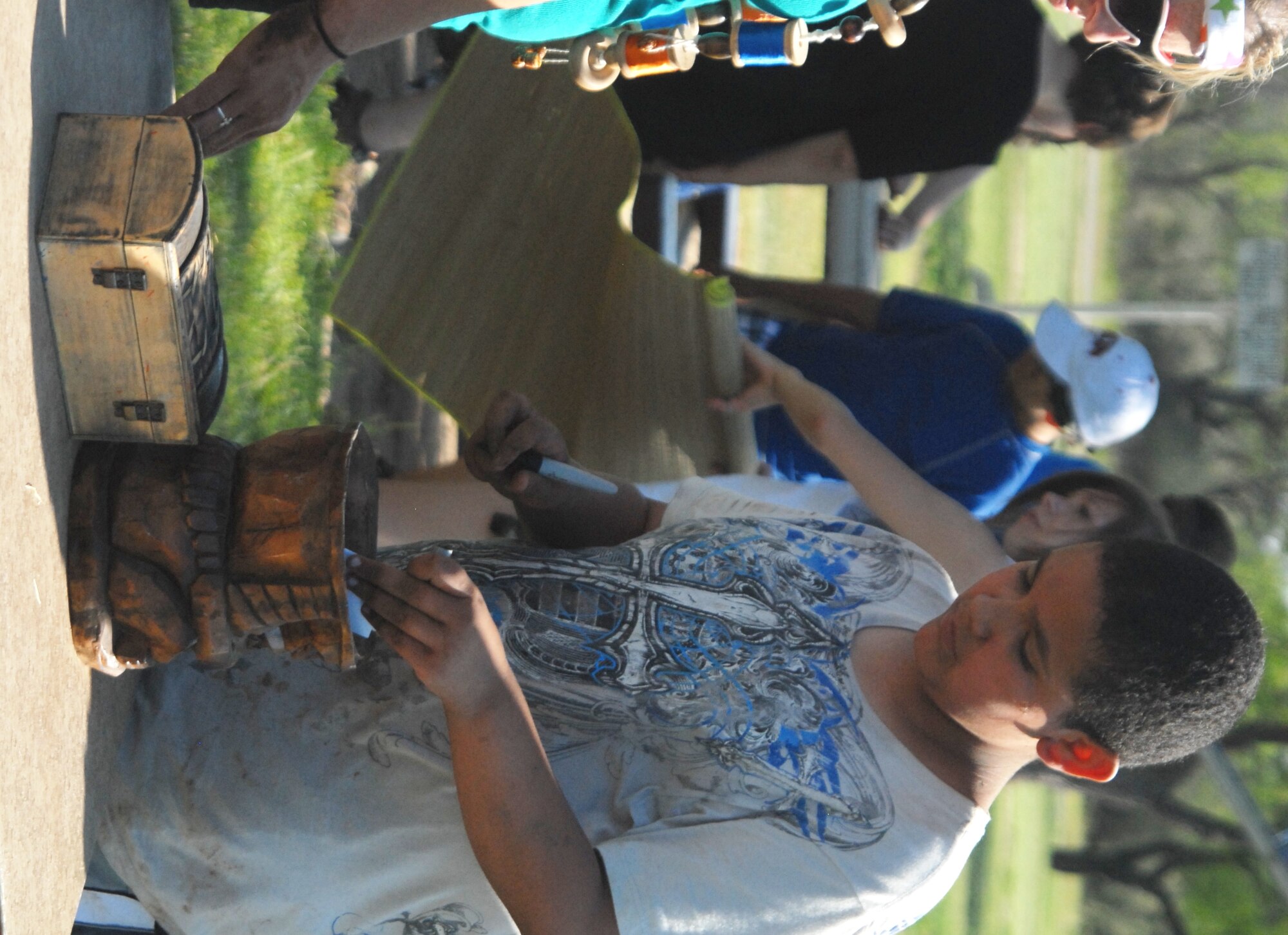 Jesse Gutierrez, 11, casts his elimination vote during the Youth Center's 9th Annual Survivor Weekend June 4-6 at Hot Water Slough Park. Fourteen youth ages 9-18 spent three days competing in "Survivor" challenges that tested their strength and taught them problem solving skills, team work and self confidence. (U.S. Air Force photo/Connie Hempel)