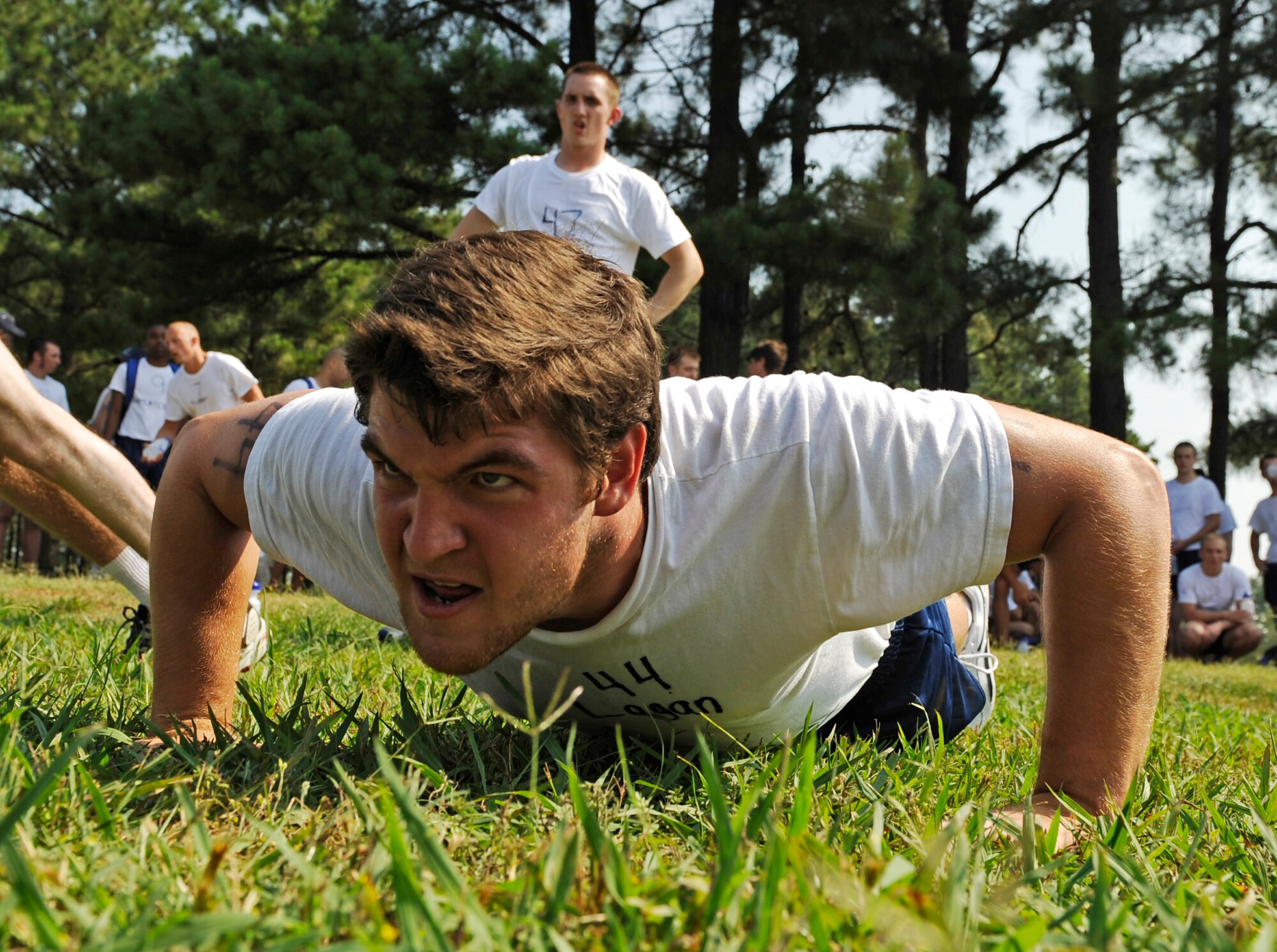 A Battlefield Airman trainee pushes out his last few repetitions on the push-up portion of his physical ability and stamina test June 2, 2010 at Little Rock Air Force Base, AR. Future Airmen, currently in the delayed entry program, were given the opportunity to train with Air Force combat controllers, pararescuemen and various other special operations career fields. The training is designed to better prepare them for the indoctrination course that they will go through for their specific career field. (U.S. Air Force photo/ Senior Airman Ryan Crane)
