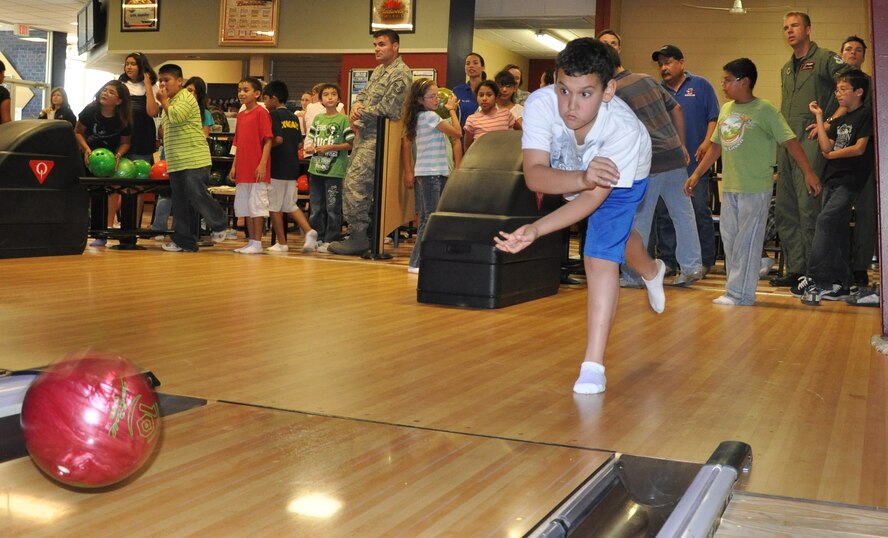 LAUGHLIN AIR FORCE BASE, Texas – A child from one of Del Rio’s elementary schools takes his turn bowling at Cactus Lanes here June 3 during an event sponsored by the Laughlin Education and Enrichment Program. More than 50 Laughlin members volunteer their time to LEEP, which is geared toward mentoring young children. (U.S. Air Force photo by Airman 1st Class Blake Mize)