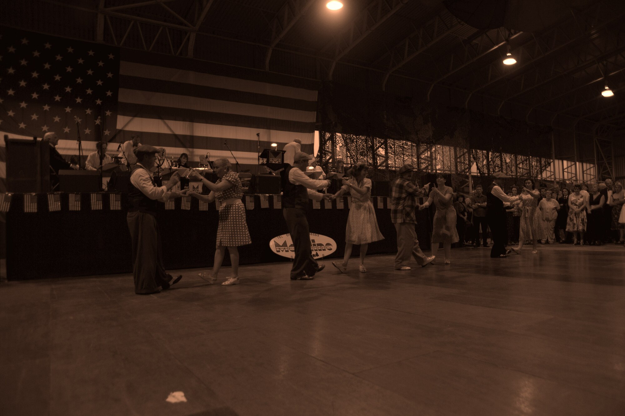 RAF MOLESWORTH, United Kingdom - More than 500 members from local tri-base area and surrounding community attended the annual Hangar Dance here June 5. The dance is based off a 1940's style atmosphere and has been a tradition here since 1988. Veterans from World War II were invited to the dance for free. (U.S. Air Force photo by Staff Sgt. Joel Mease)