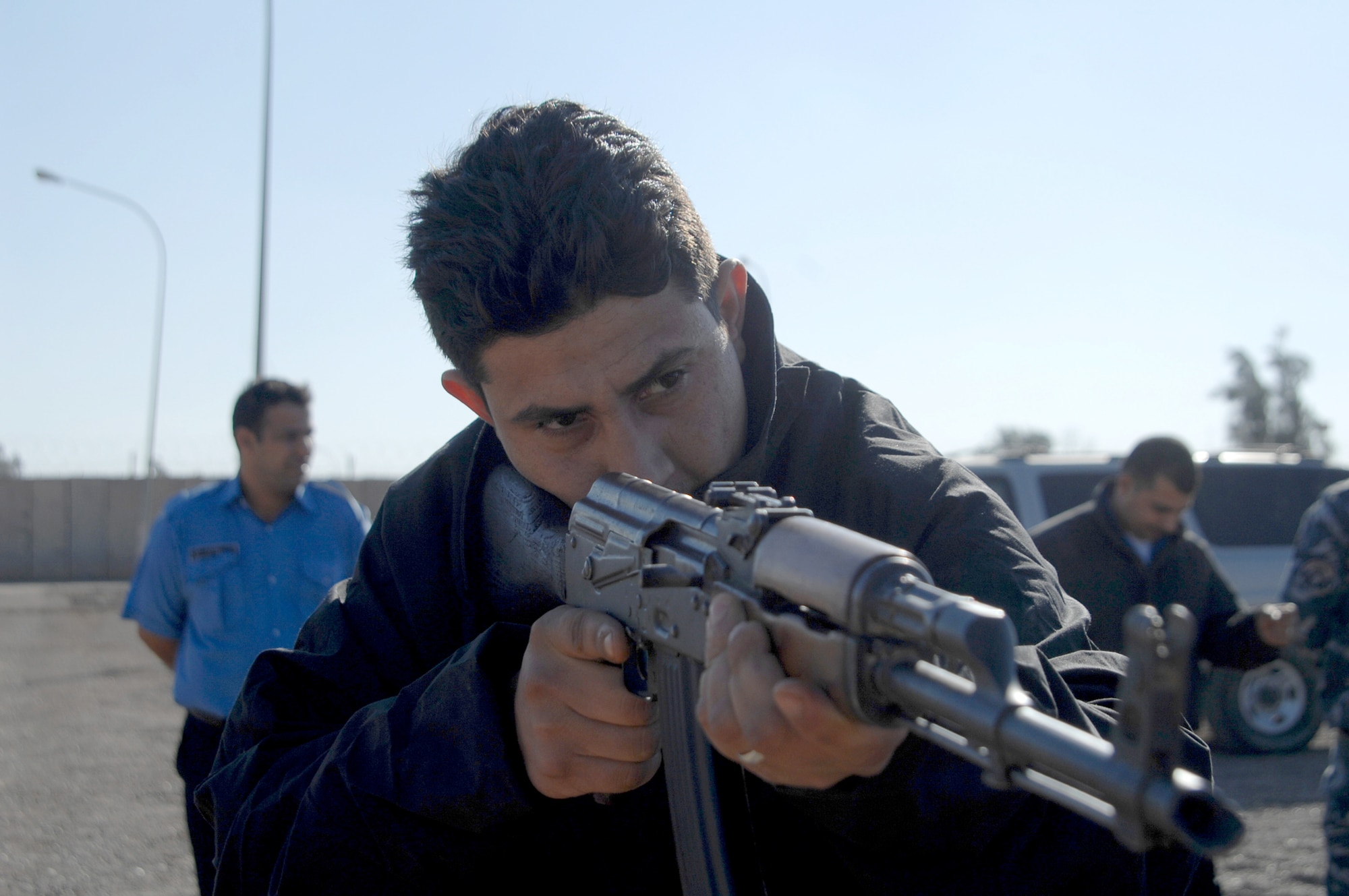 Iraqi police officers perform weapons-handling training at Taji Law Enforcement Academy Jan. 6, 2010, at Camp Taji, Iraq.  (U.S. Army photo/Spc. David C. Innes Jr.) 