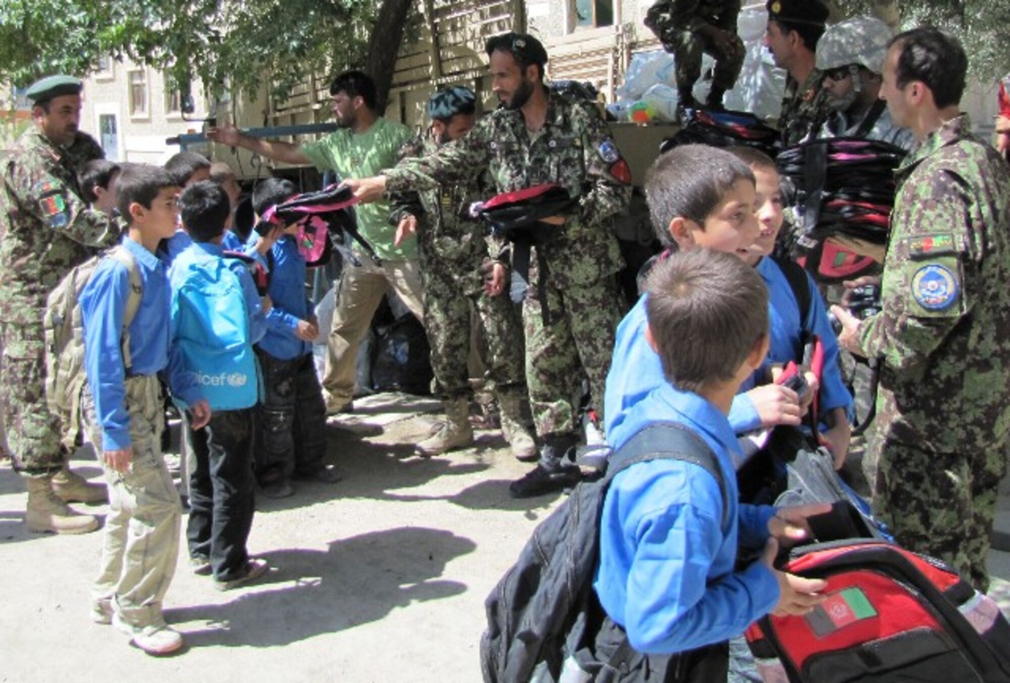 Members of the Afghan Air Corps provide much needed school supplies to the Ahmad Jaweed School located in District 15, about 2 miles north of Kabul International Airport and the home of the Afghan Air Corps on June 7th, 2010. (U.S. Air Force Photo by Capt. Rob Leese/RELEASED)