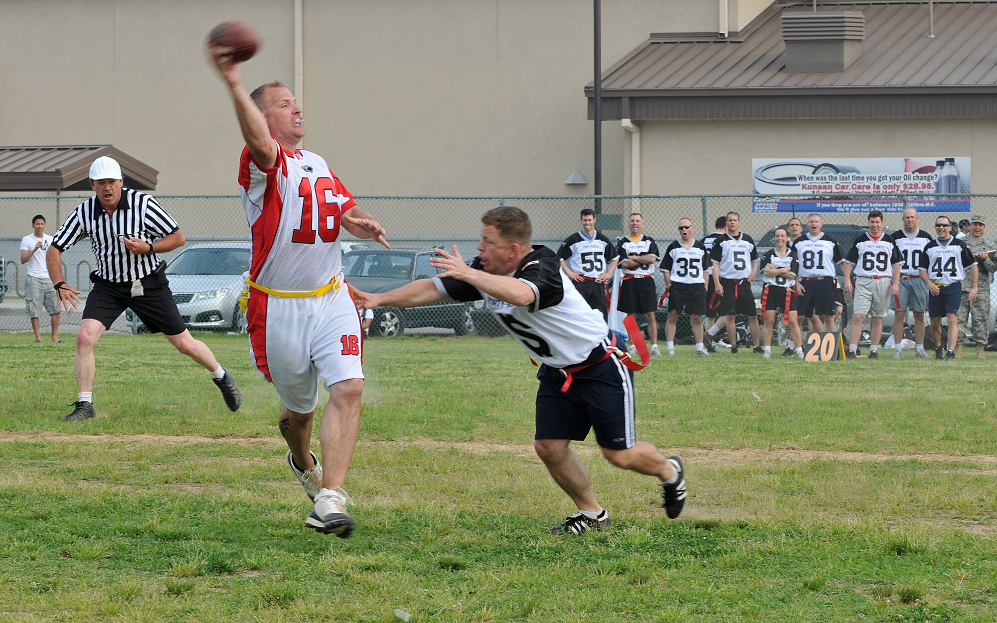 Master Sgt. Warren Benge, 8th Force Support Squadron first sergeant and Chiefs quarterback, tries to connect a pass as Maj. Steven Strain, 8th Comptroller Squadron commander, blitzes for a down during the Chiefs vs. Eagles game May 21 at Kunsan Air Base, Republic of Korea. The Chiefs and Eagles game was a culmination of events that took place throughout the Junior Enlisted Appreciation Day. The JEAD was hosted by members of the Kunsan Top III Association and supported by wing leadership. (U.S. Air Force photo/Capt. Shannon Collins)