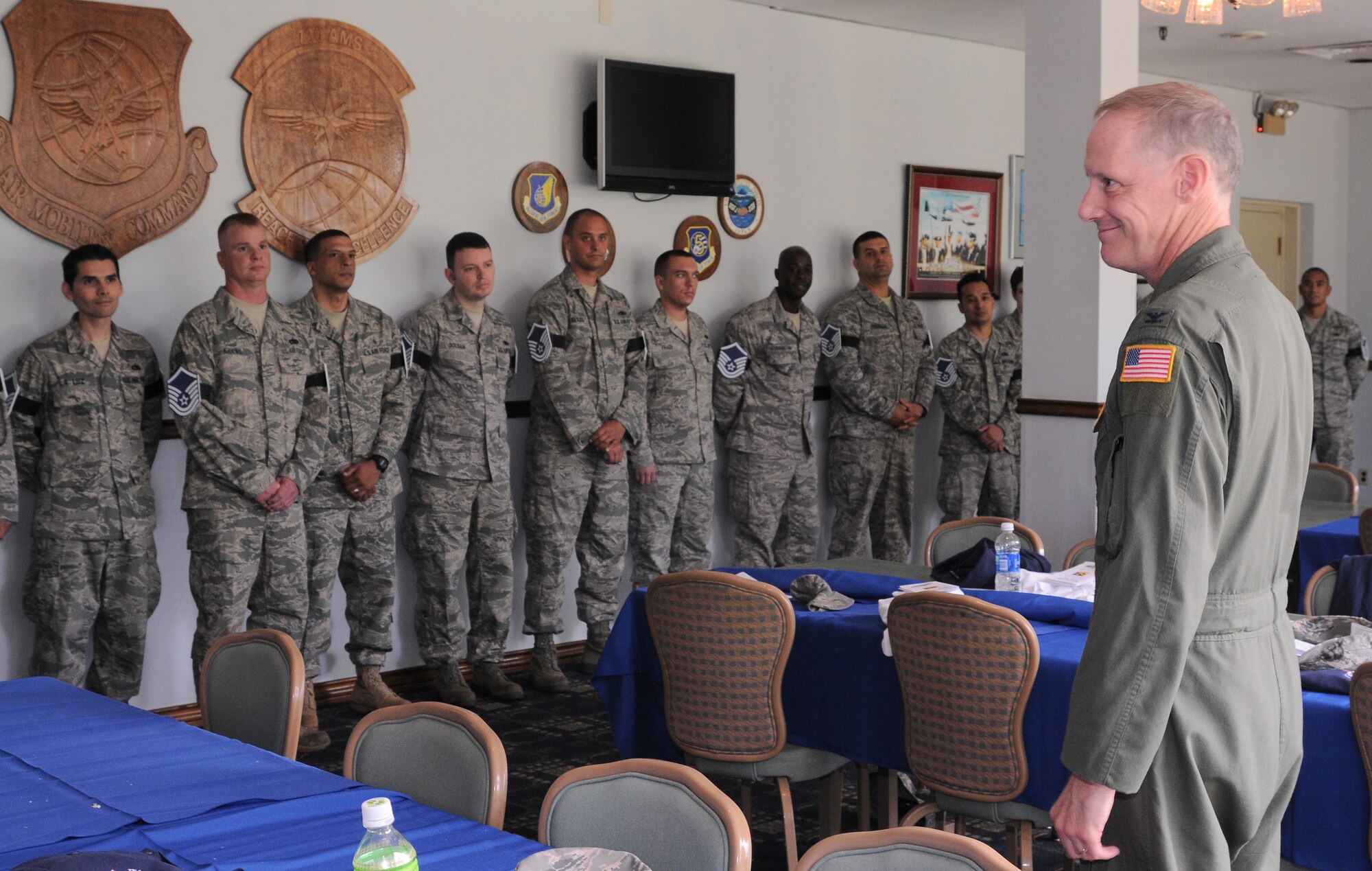 YOKOTA AIR BASE, Japan-- Col. Otto Feather, 374th Airlift Wing commander, congratulates the newly selected Master Sergeants before  a social held at the Enlisted Club here June 4. Forty-one Yokota technical sergeants were among the 5,424 selected May 28 for promotion to master sergeant. (U.S. Air Force Photo/ Airman 1st Class Katrina R. Menchaca)