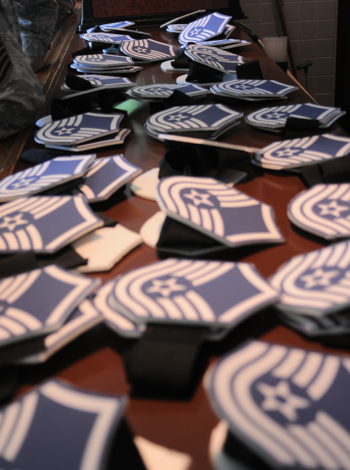 YOKOTA AIR BASE, Japan-- Displayed on a table before a social held at the Enlisted Club here June 4, are the ranks for the 41 newly selected Yokota Master Sergeants. (U.S. Air Force Photo/ Airman 1st Class Katrina R. Menchaca)