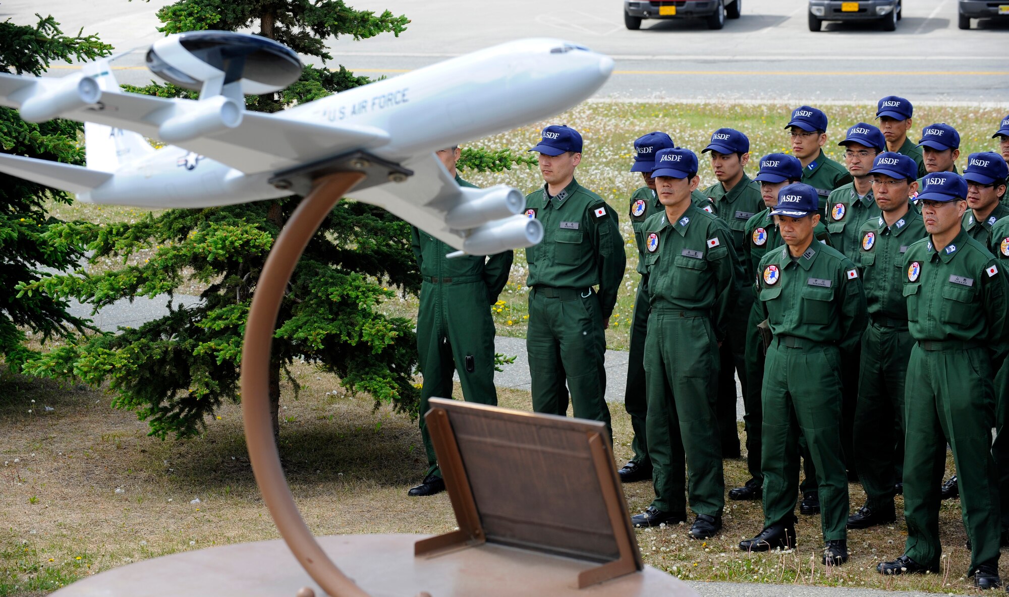 Members of the Japanese Air Self Defense Force pay tribute to fallen Airmen at the Yukla 27 Memorial on Elmendorf Air Force Base, Alaska, June 7. The Yukla 27 Memorial is dedicated in memory to the 24 American and Canadian Airmen who lost their lives in defense of freedom when an E-3B Sentry AWACS from the 962nd Airborne Air Control Squadron crashed after takeoff September 22, 1995.  The Japanese Air Self Defense Force is here participating in Red Flag Alaska 10-3, and pay tribute at the memorial every year. (U.S. Air Force photo/Staff Sgt. Brian Ferguson)