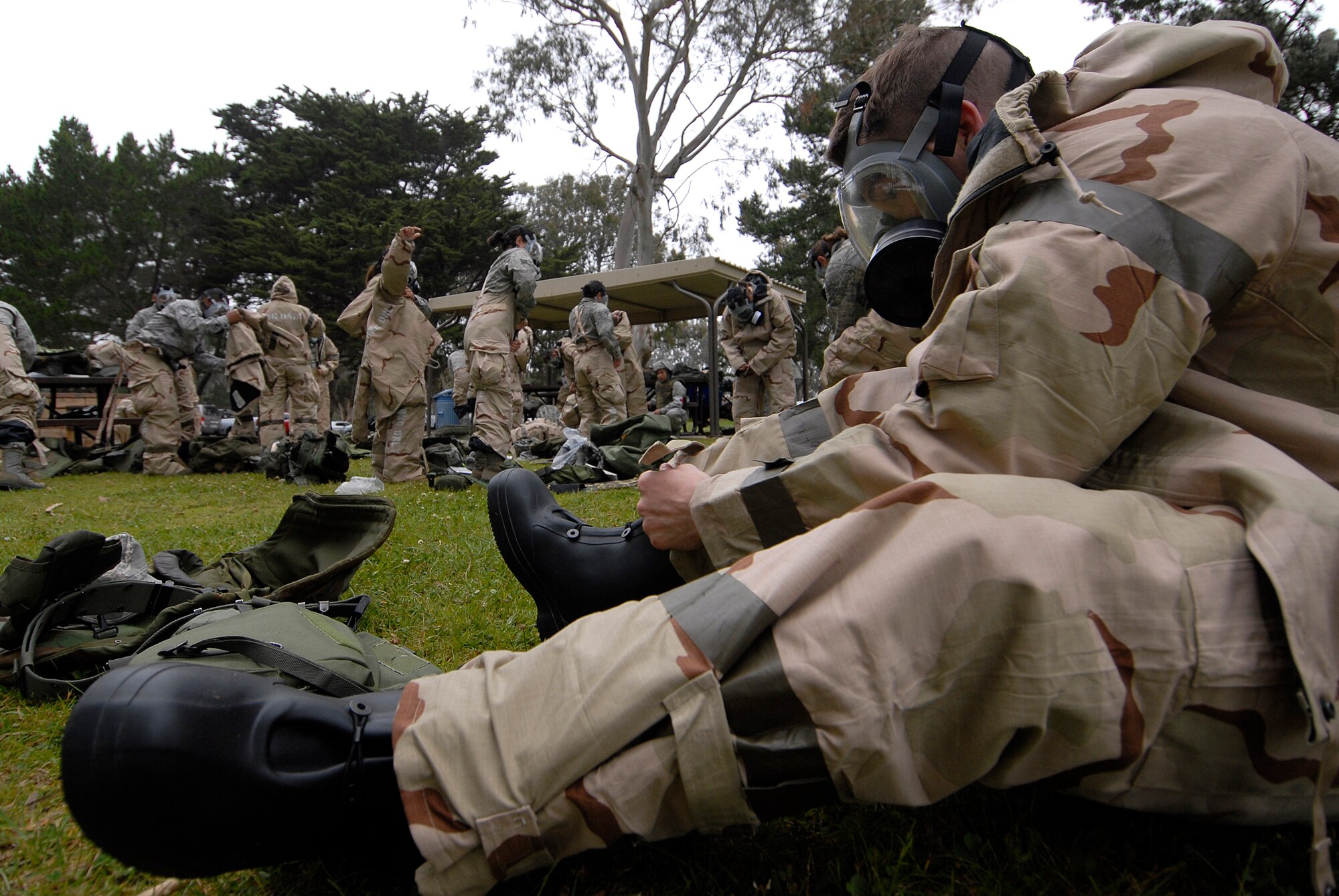 VANDENBERG AIR FORCE BASE, Calif. --  Airman Travis Vick, of the 30th Logistics Readiness Squadron, puts his boot on during a North Star training course at Cocheo Park here Tuesday, June 8, 2010. The course is designed to train Airmen how to react to various situations during a wartime contingency exercise and real world situations.  (U.S. Air Force photo/Senior Airman Andrew Satran) 

 




