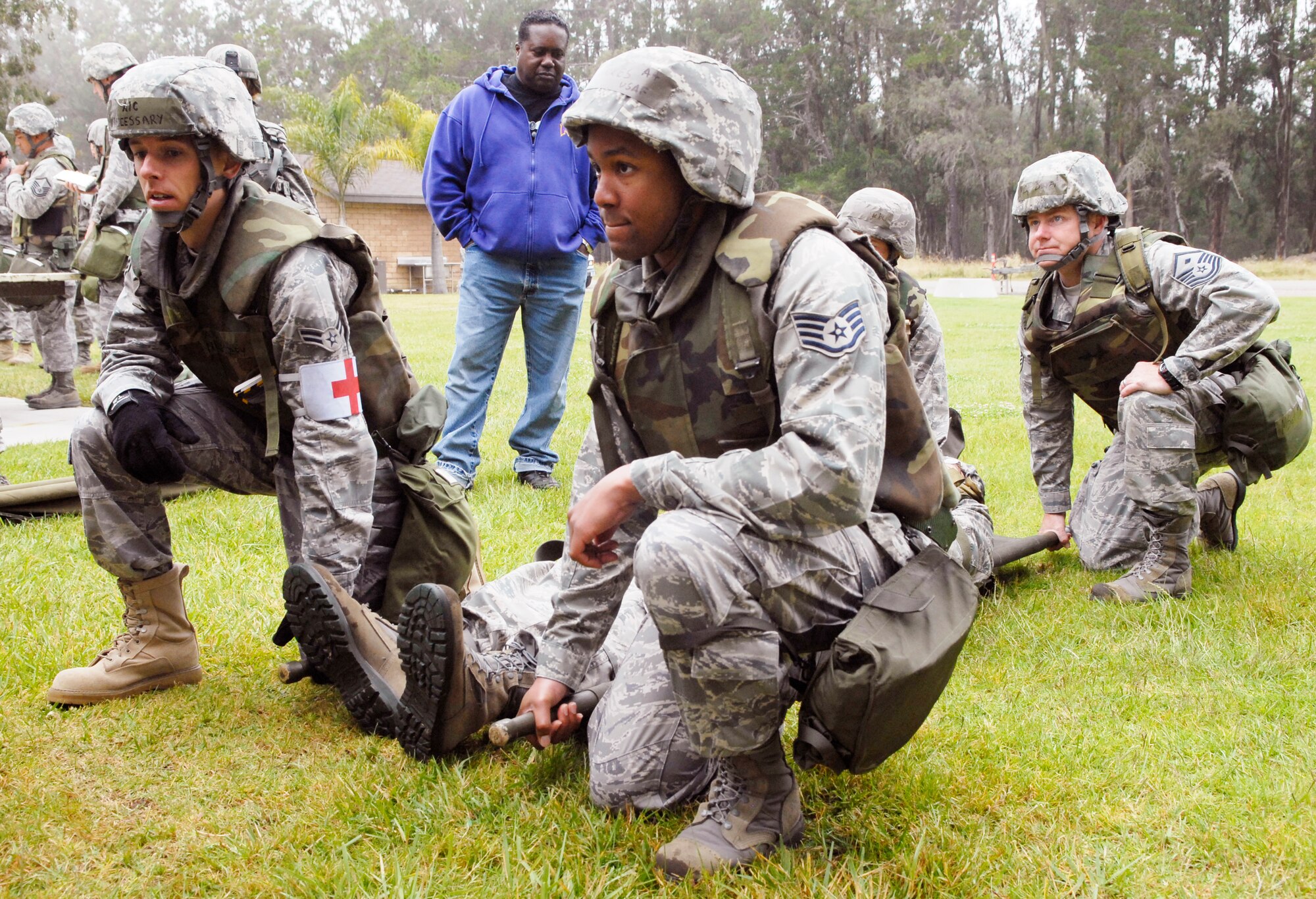 VANDENBERG AIR FORCE BASE, Calif. - Airmen from Team V prepare to transport a simulated casualty during a North Star training course at Cocheo Park here Tuesday, June 8, 2010. The training course concentrated on expedient patient transportation, nine-line medical evacuation requests, self aid and buddy care, identifying unexploded ordnance and mission oriented protective posture levels. (U.S. Air Force photo/Senior Airman Christopher Hubenthal)







