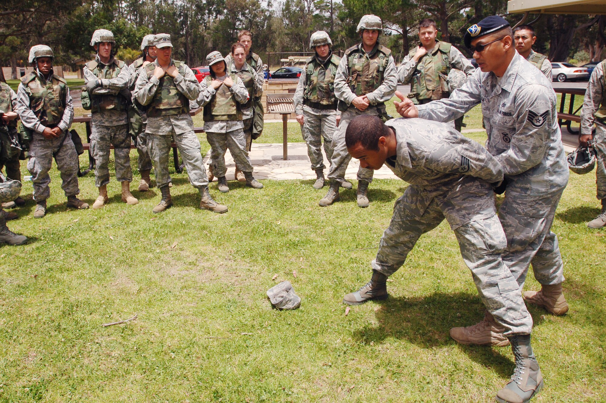 VANDENBERG AIR FORCE BASE, Calif. - Instructing by example, Staff Sgt. Rodrake Ea, a 30th Security Forces Squadron unit trainer, goes through the steps on how to search a detainee during a North Star Training exercise at Cocheo Park here Monday, June 7, 2010. The training Airmen receive will be evaluated later in the week during a wartime contingency exercise. (U.S. Air Force photo/Senior Airman Christopher Hubenthal)

