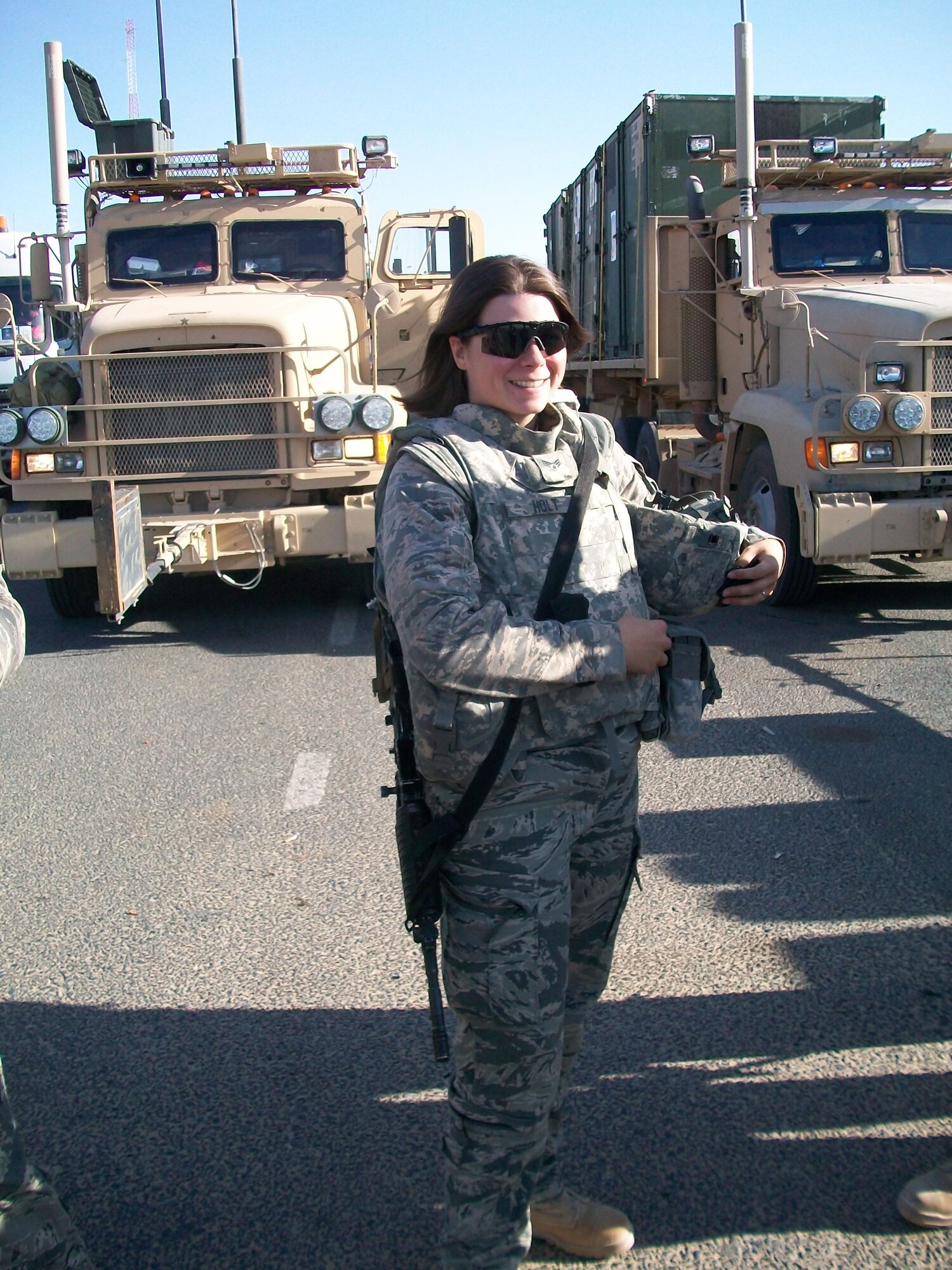 Senior Airman Stephanie A. Holt, deployed from the 586th Expeditionary Logistics Readiness Squadron, Camp Arijan, Kuwait, prepares for a long haul through Kuwait and Iraq, delivering supplies to coalition forces. Convoys consisted of as many as 40 trucks at one time.