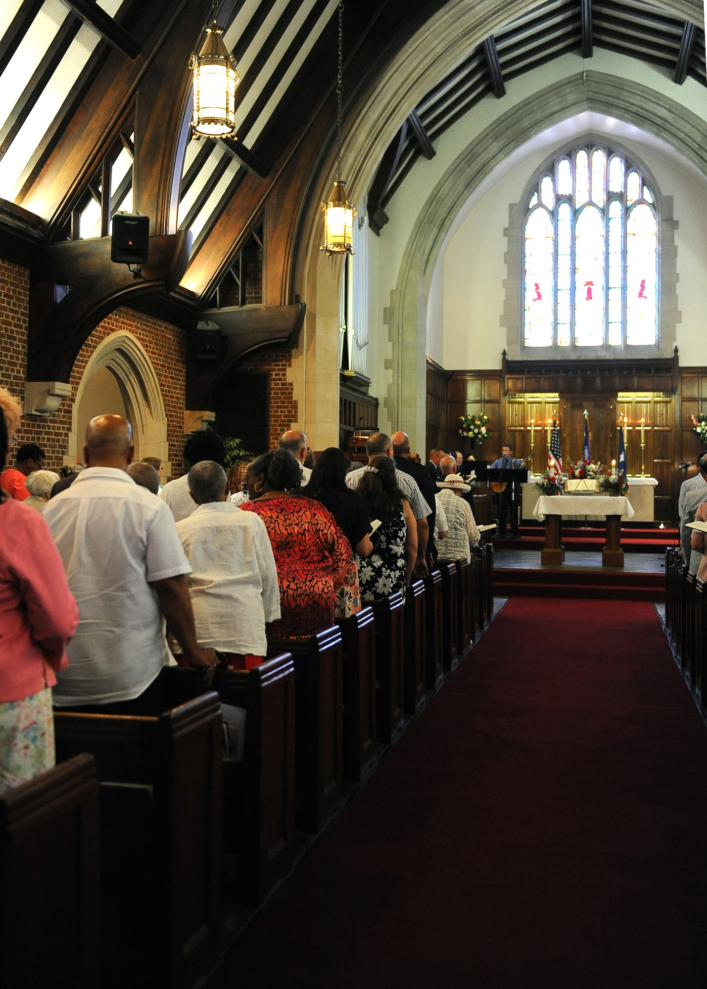 LANGLEY AIR FORCE BASE, Va. -- Guests sing along to spiritual music at the Langley Chapel during the chapel’s 75th anniversary service June 6. The church conducted its first service April 21, 1935, a christening for 34 dependent children. (U.S. Air Force photo/Senior Airman Gul Crockett)