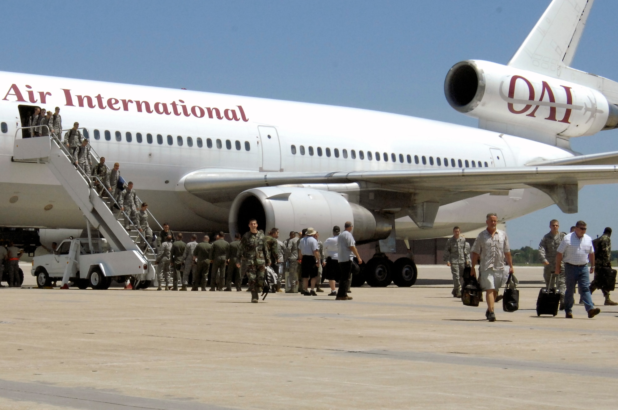 WHITEMAN AIR FORCE BASE, Mo. - Members of the 509th and 131st Bomb Wings deboard an aircraft June 4 here returning from a four-month deployment to Andersen AFB, Guam. More than 200 members of Team Whiteman deployed along with four B-2 Spirits to provide a continuous bomber presence in the Pacific. (U.S. Air Force photo/Senior Airman Jason Barebo)