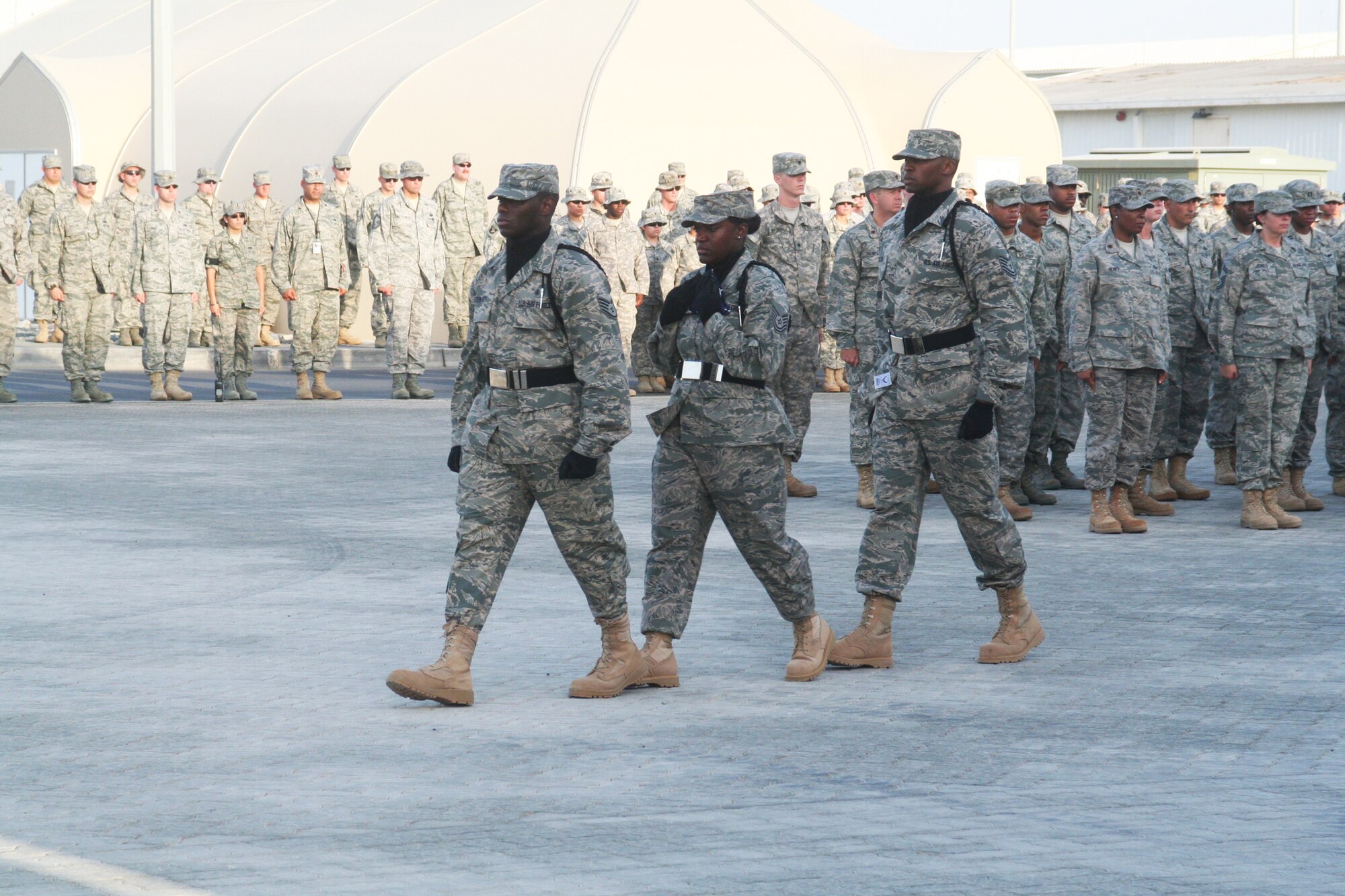 Airmen from the 380th Air Expeditionary Wing Honor Guard participate in a wing retreat ceremony on May 28, 2010, at a non-disclosed base in Southwest Asia. Every week the 380th AEW holds a retreat ceremony honoring the American flag as part of a continuing military tradition. On May 28, the 380th Expeditionary Medical Group served as the lead unit for the retreat. The 380th AEW supports operations Iraqi Freedom and Enduring Freedom and the Combined Joint Task Force-Horn of Africa. (U.S. Air Force Photo/Master Sgt. Scott T. Sturkol/Released)
